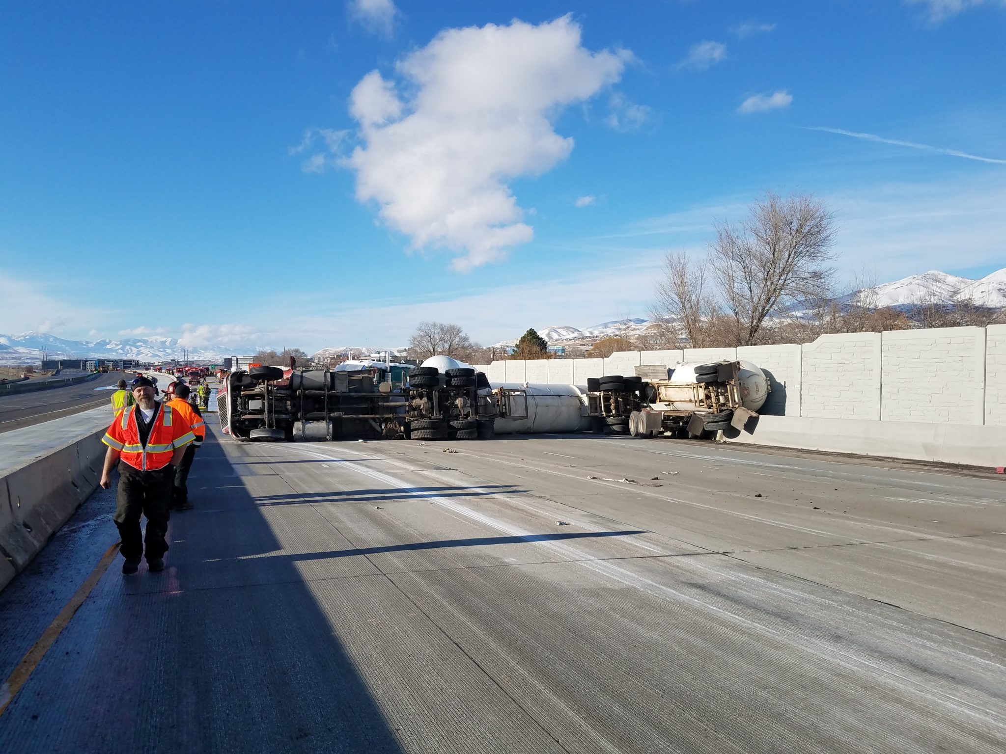 An 18-wheeler carrying flammable fuel has tipped over on I-15 in Lehi, blocking the northbound lanes and closing the highway in both directions near 1800 North on Saturday, November 30, 2019. (Utah Highway Patrol)