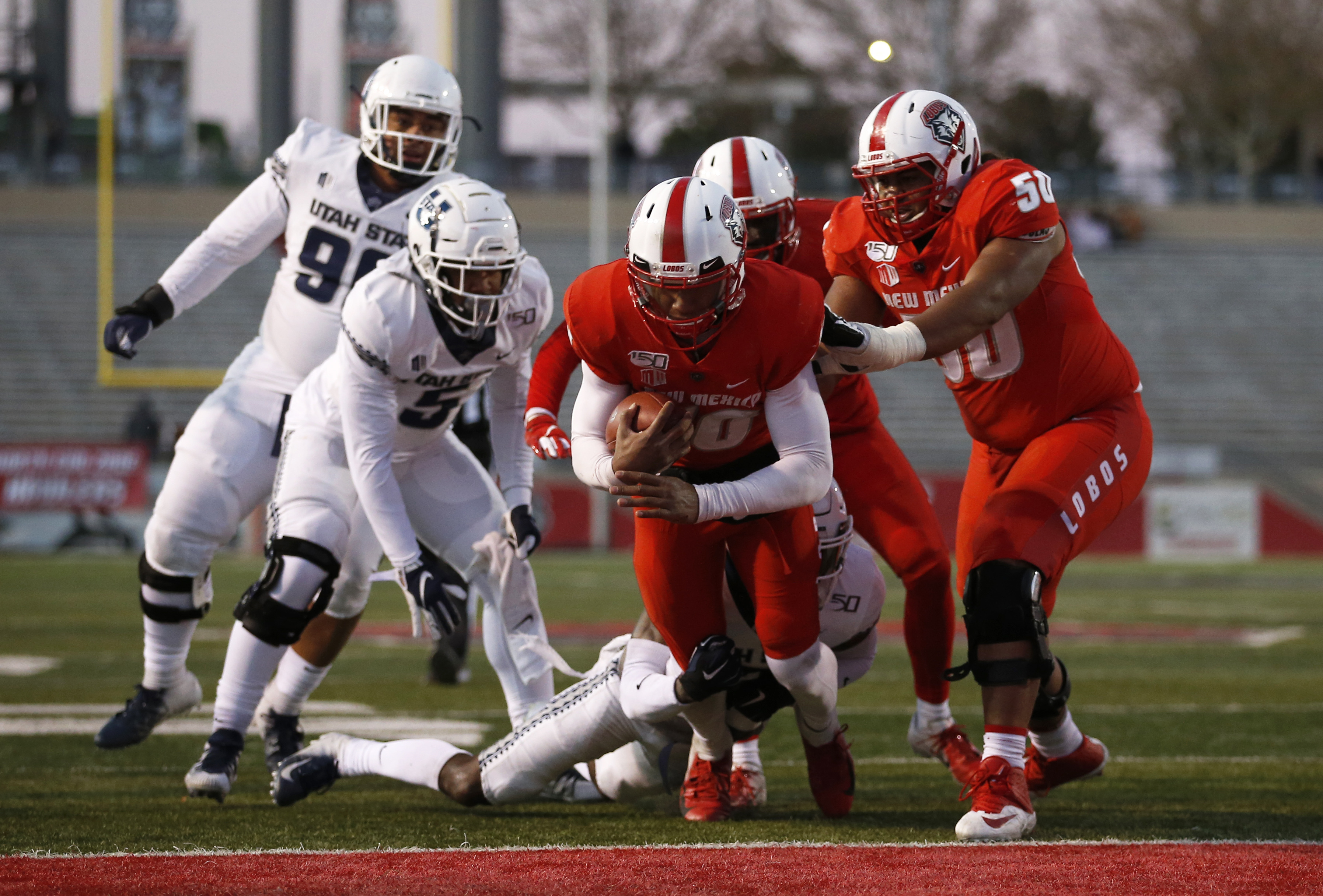 Love leads Utah State to 38-25 victory over New Mexico