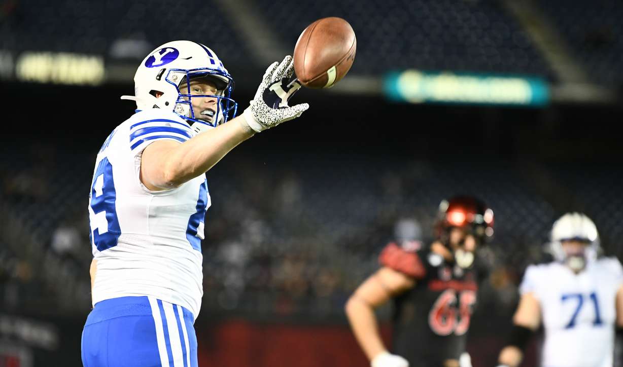 BYU tight end Matt Bushman gives the ball back to the official after a catch during the Cougars' college football game against San Diego State, Saturday, Nov. 30, 2019 at SDCUU Stadium in San Diego. (Photo: Michael Lu for KSL.com)