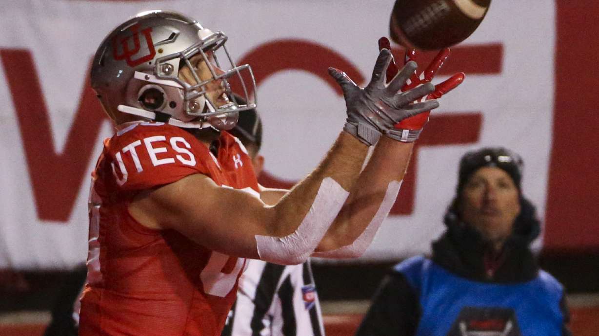 Utah Utes tight end Brant Kuithe (80) catches a touchdown pass from quarterback Tyler Huntley, not pictured, during the first half of an NCAA football game at Rice-Eccles Stadium in Salt Lake City on Saturday, Nov. 30, 2019.