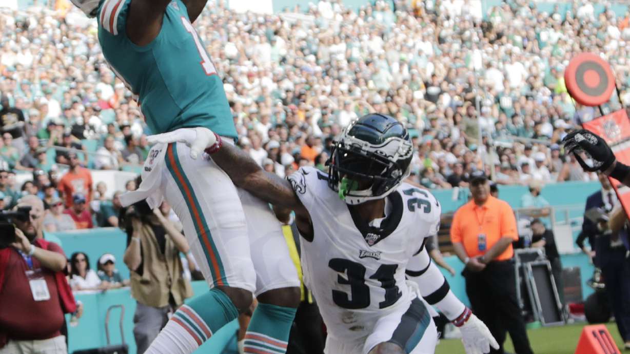 Bag of tricks helps Dolphins rally past Eagles 37-31