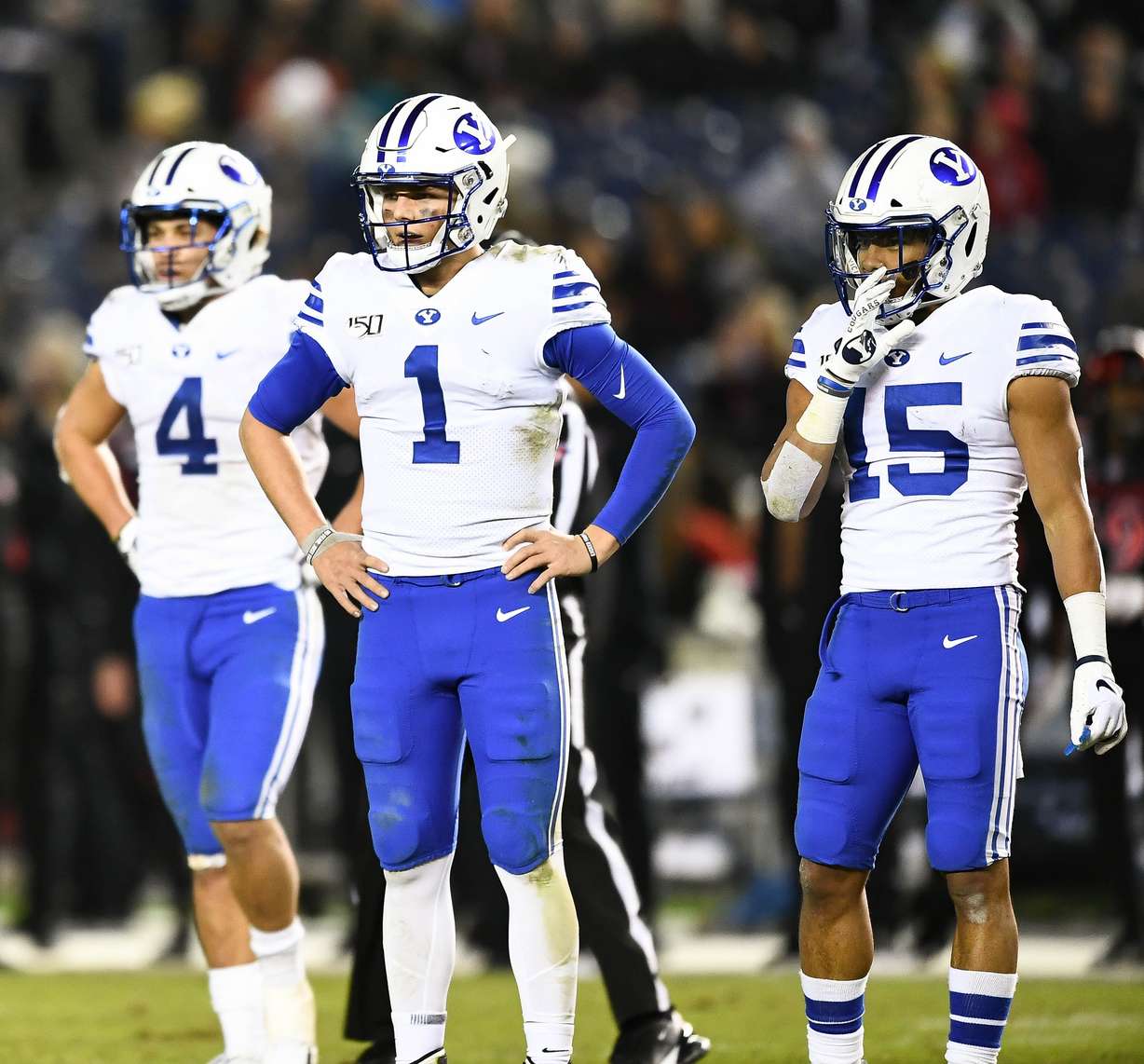 BYU's Lopini Katoa, Zach Wilson and Aleva Hifo look to the sidelines for a play while trying to rally in the second half of the Cougars' 13-3 loss to San Diego State at SDCCU Stadium, Saturday, Nov. 30, 2019 in San Diego. (Photo: Michael Lu for KSL.com)