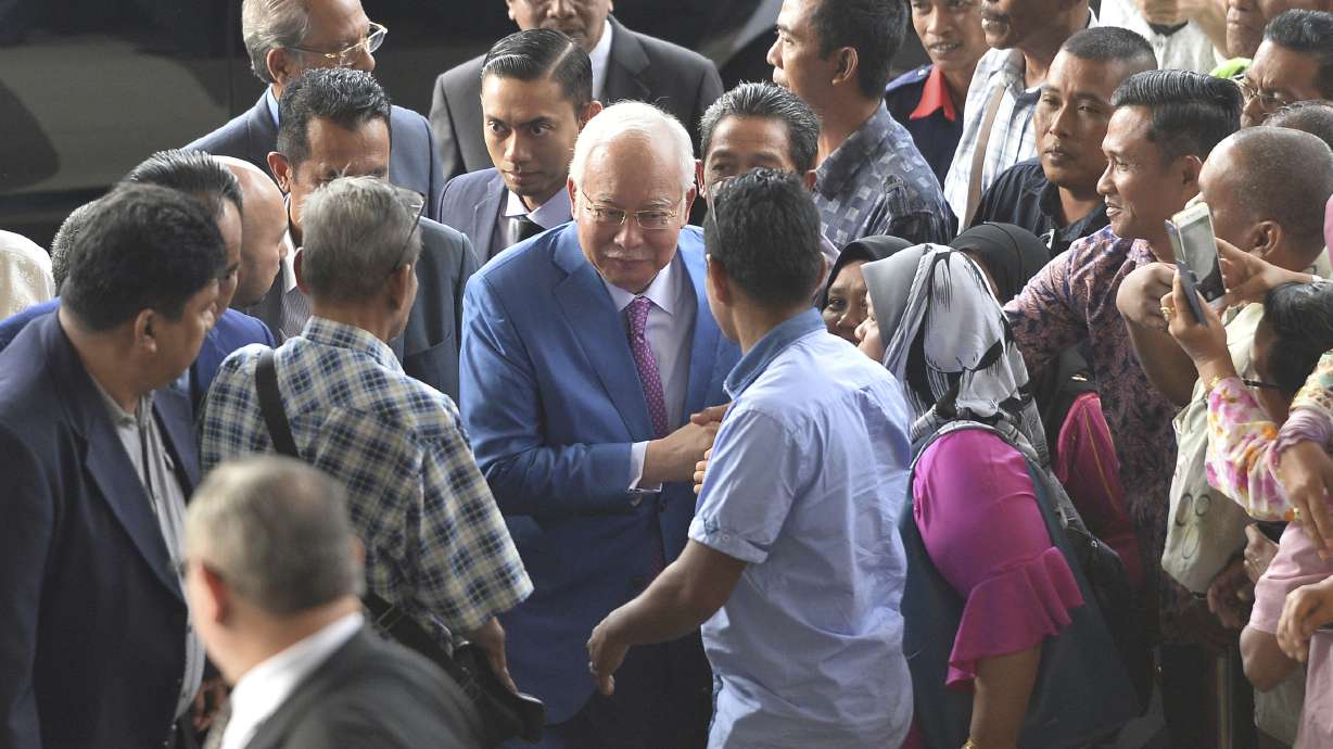 Malaysia’s ex-PM Najib seeks to show he’s victim of fugitive