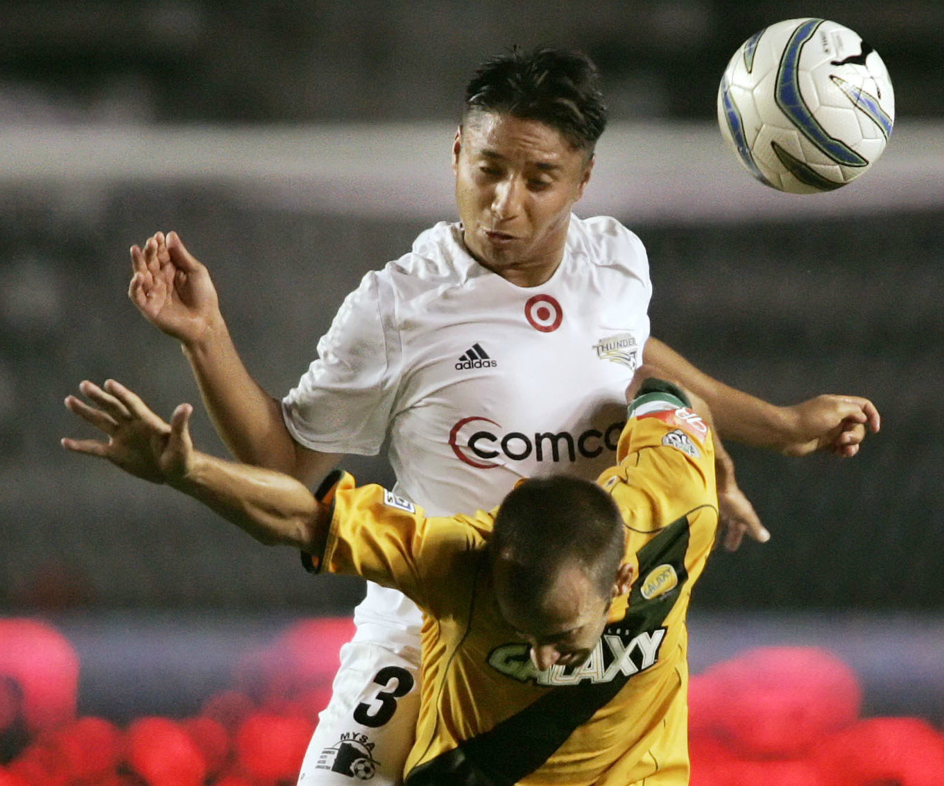 Minnesota Thunder's Freddy Juarez (3) jumps over the back of Los Angeles Galaxy's Peter Vagenas while heading the ball in the first half of the U.S. Open Cup semifinals at the Home Depot Center in Carson, Calif. on Wednesday, Sept.14, 2005. (Photo: Francis Specker, AP)