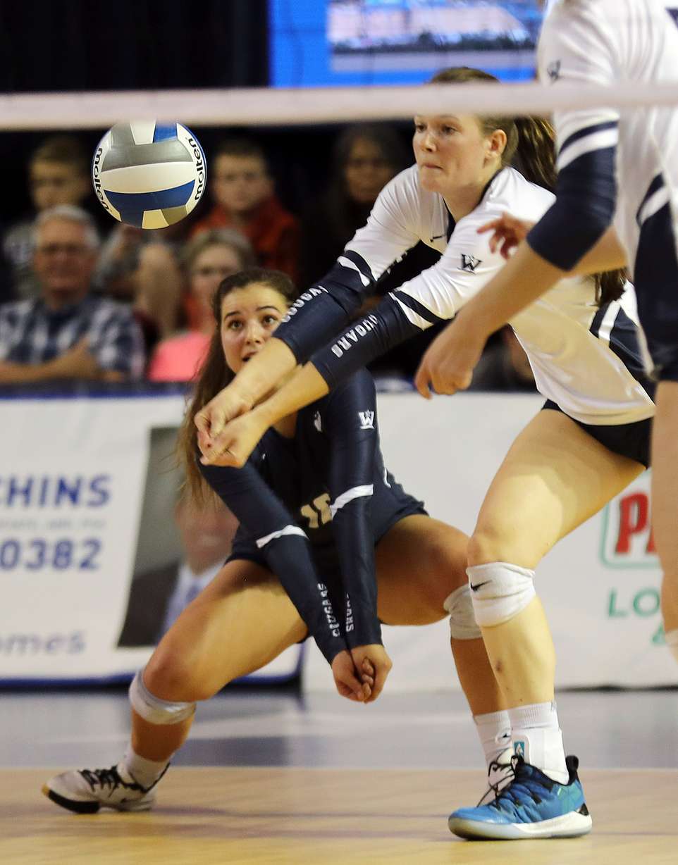 Mary Lake, left and Madelyn Robinson of BYU go for a bump against San Diego during an NCAA volleyball match in Provo on Friday, Oct. 18, 2019. (Photo: Ravell Call, KSL)