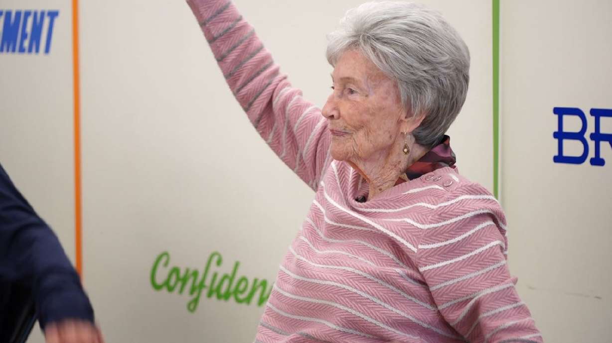 96-year-old woman stays active by attending a seated exercise class twice a week
