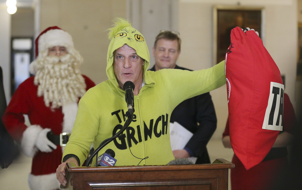 Greg Zenger, dressed as the Grinch, speaks during a press conference about tax reform at the Capitol in Salt Lake City on Friday, Dec. 6, 2019. (Photo: Jeffrey D. Allred, KSL)