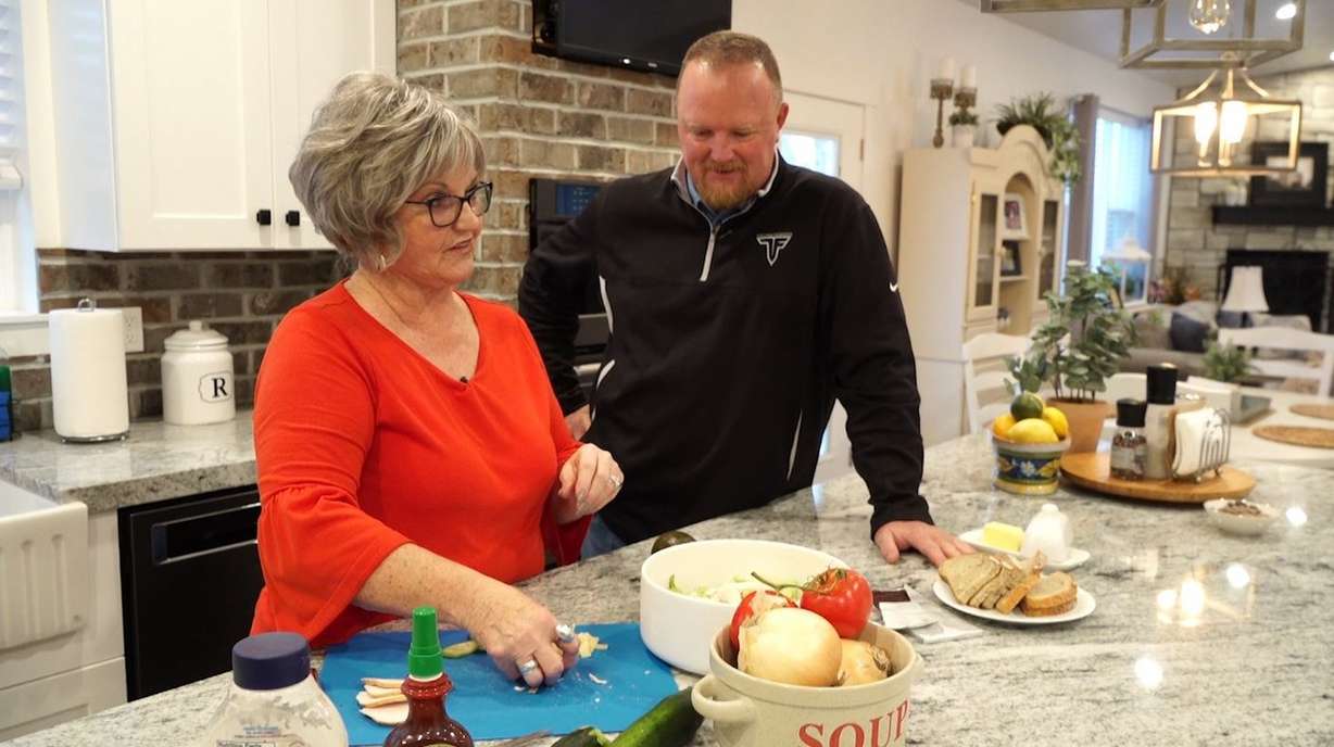 Johnny Revill and his mother, Renita Revill, make a healthy salad together. (Photo: KSL TV)