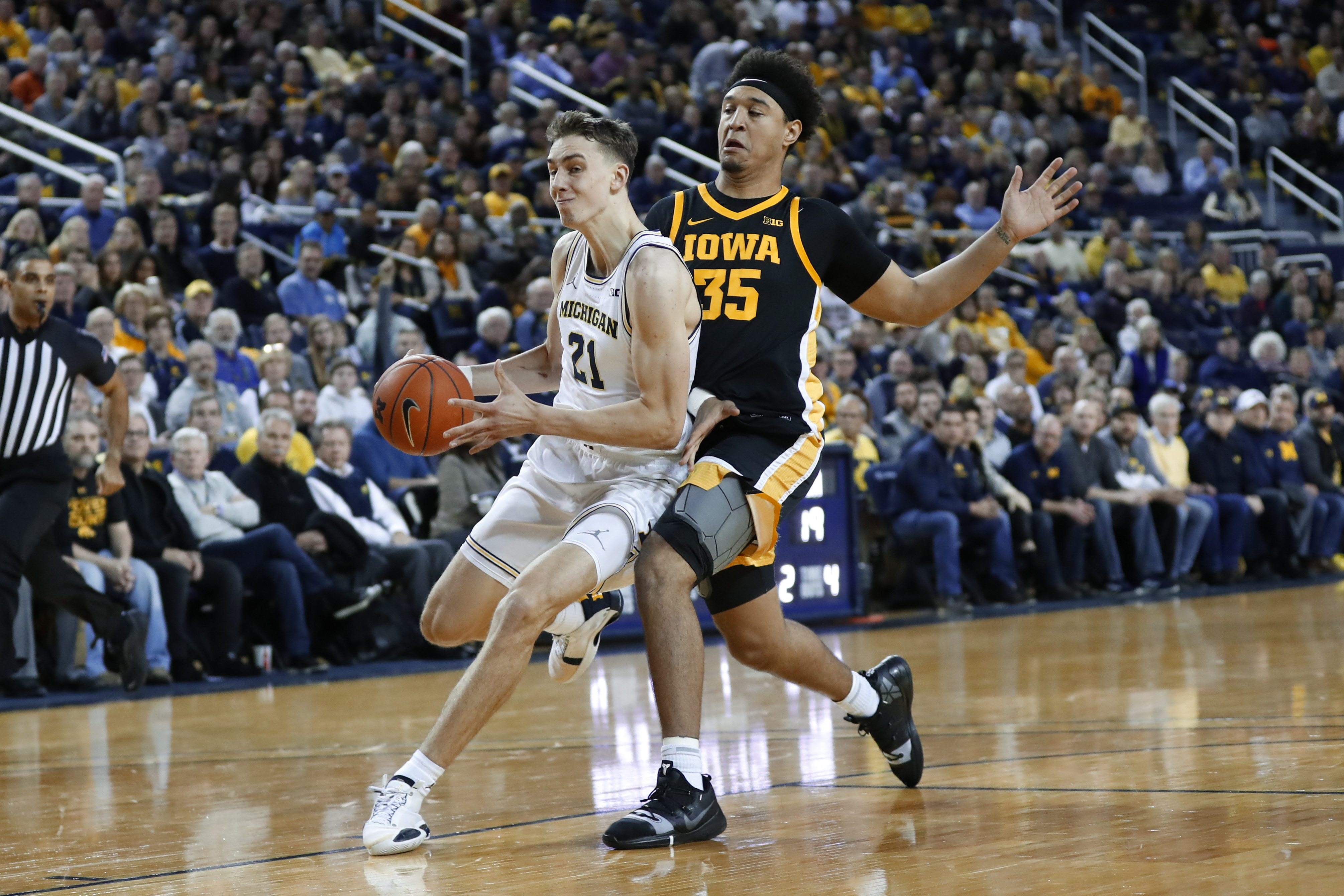 No. 4 Michigan tops Iowa 103-91 despite 44 points from Garza