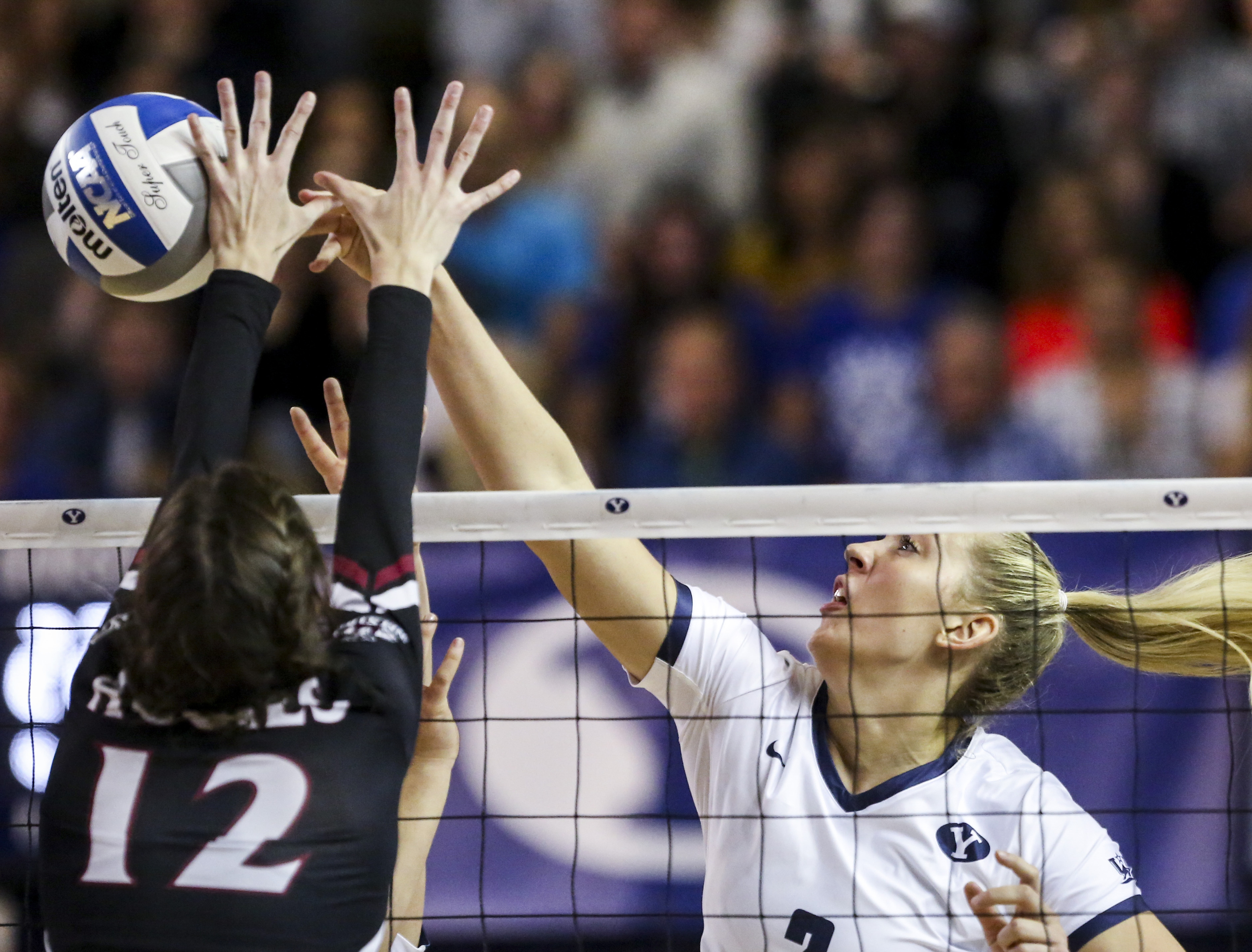 BYU middle blocker Heather Gneiting (2) gets a point against New Mexico State middle blocker Megan Hart (12) during the second set of a first round volleyball match in the 2019 NCAA Women's Volleyball Tournament at the Smith Fieldhouse in Provo on Friday, Dec. 6, 2019. (Photo: Colter Peterson, KSL)