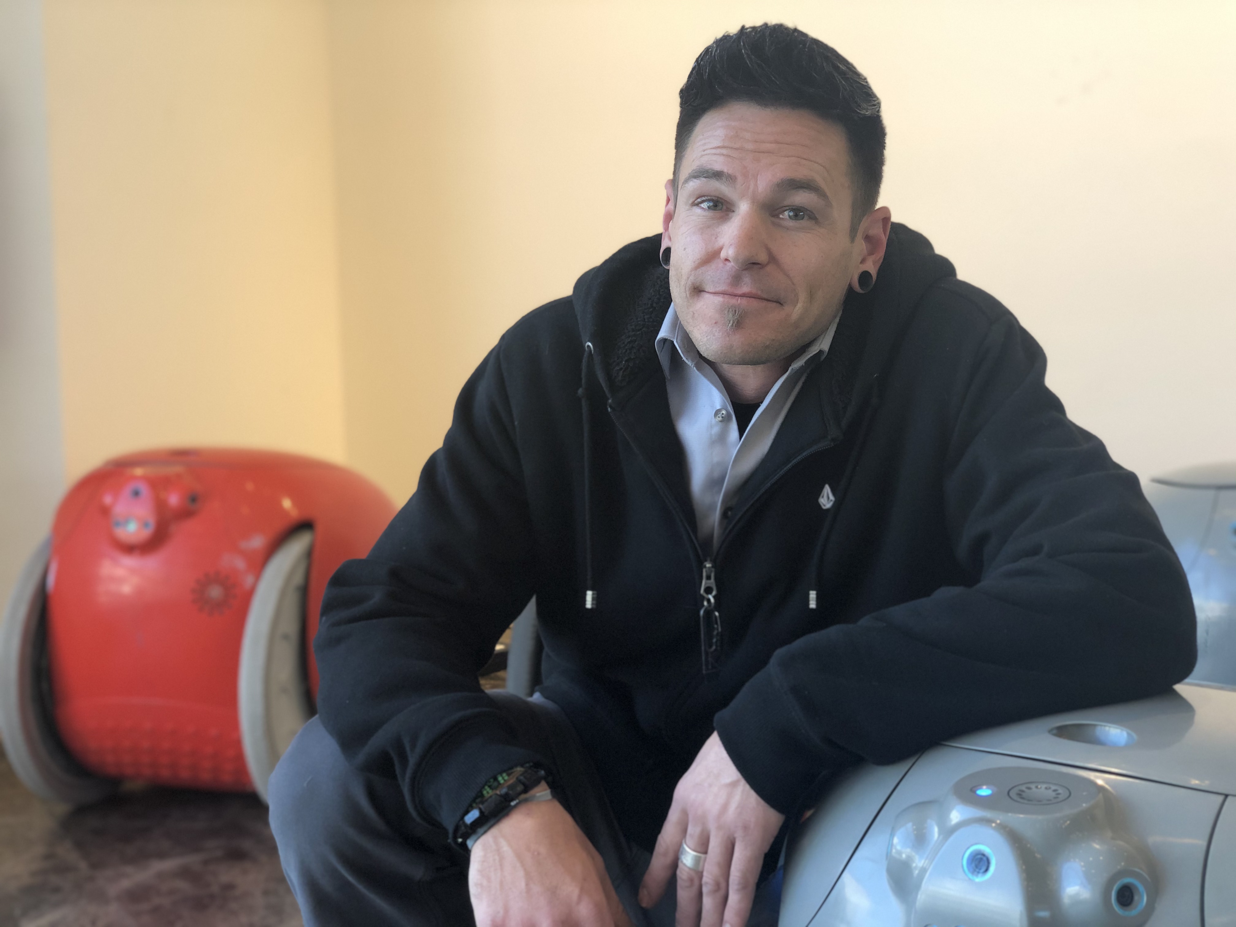 Mark Brinton poses next to one of the robot prototypes that Salt Lake residents have been testing over the last several weeks. (Photo: Liesl Nielsen, KSL.com)