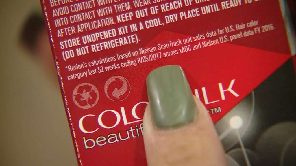 Amanda Ortega points to the expiration date on the hair dye she purchased from a Magna Smith’s location. Photo: Steve Breinholt, KSL TV