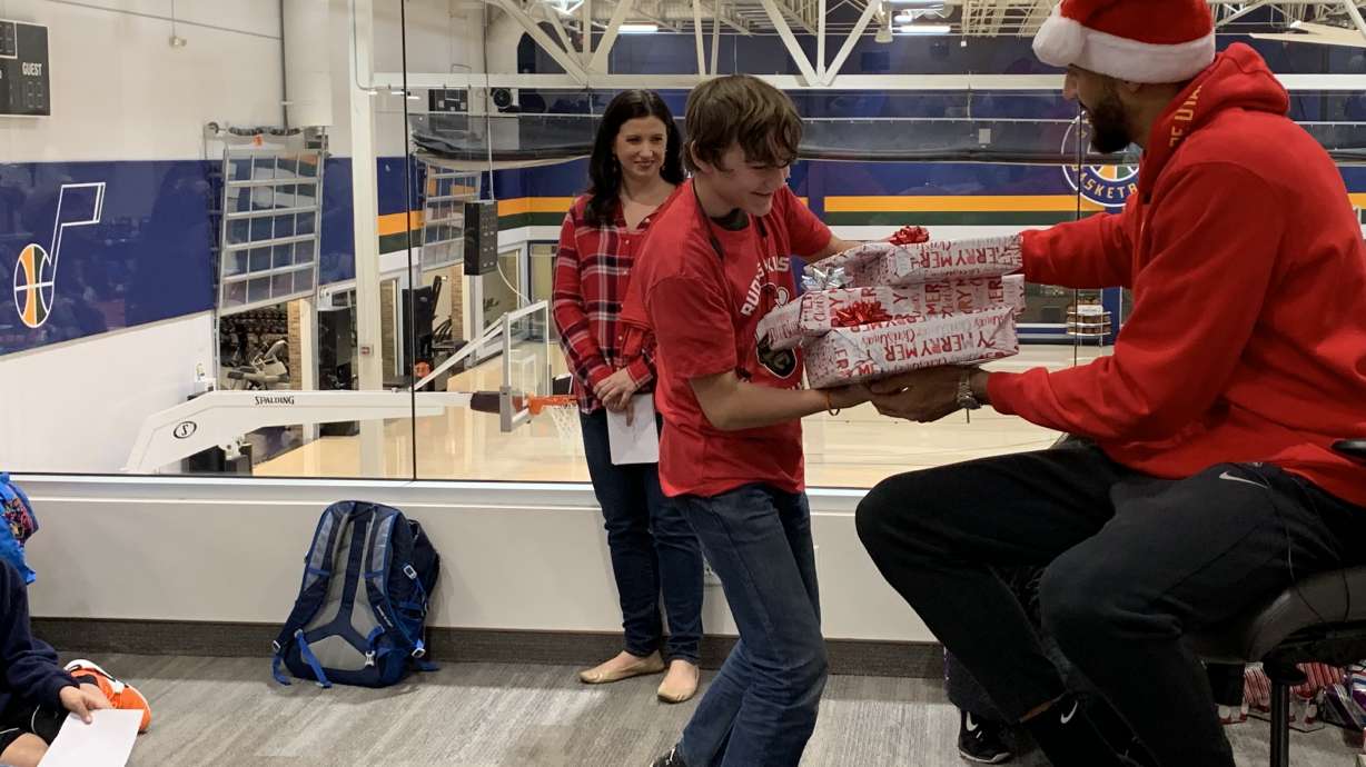 Santa Rudy: Utah Jazz center hosts Christmas for kids affected by homelessness