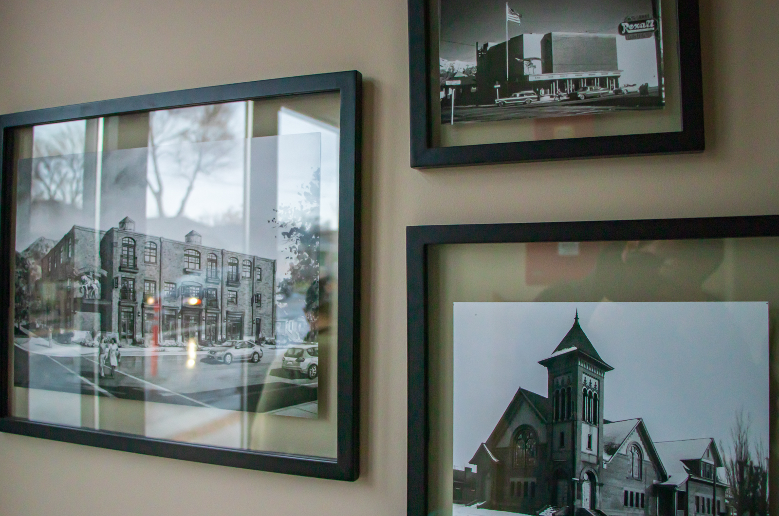 A wall in the Salt Lake Costume Apartments building with a framed photo of the artist rendering of the apartment complex, a photo of the old Westminster chapel and the Salt Lake Costume store/warehouse that all have been located at 1701 S. 1100 East in Salt Lake City over the past century. (Photo: Carter Williams, KSL.com)