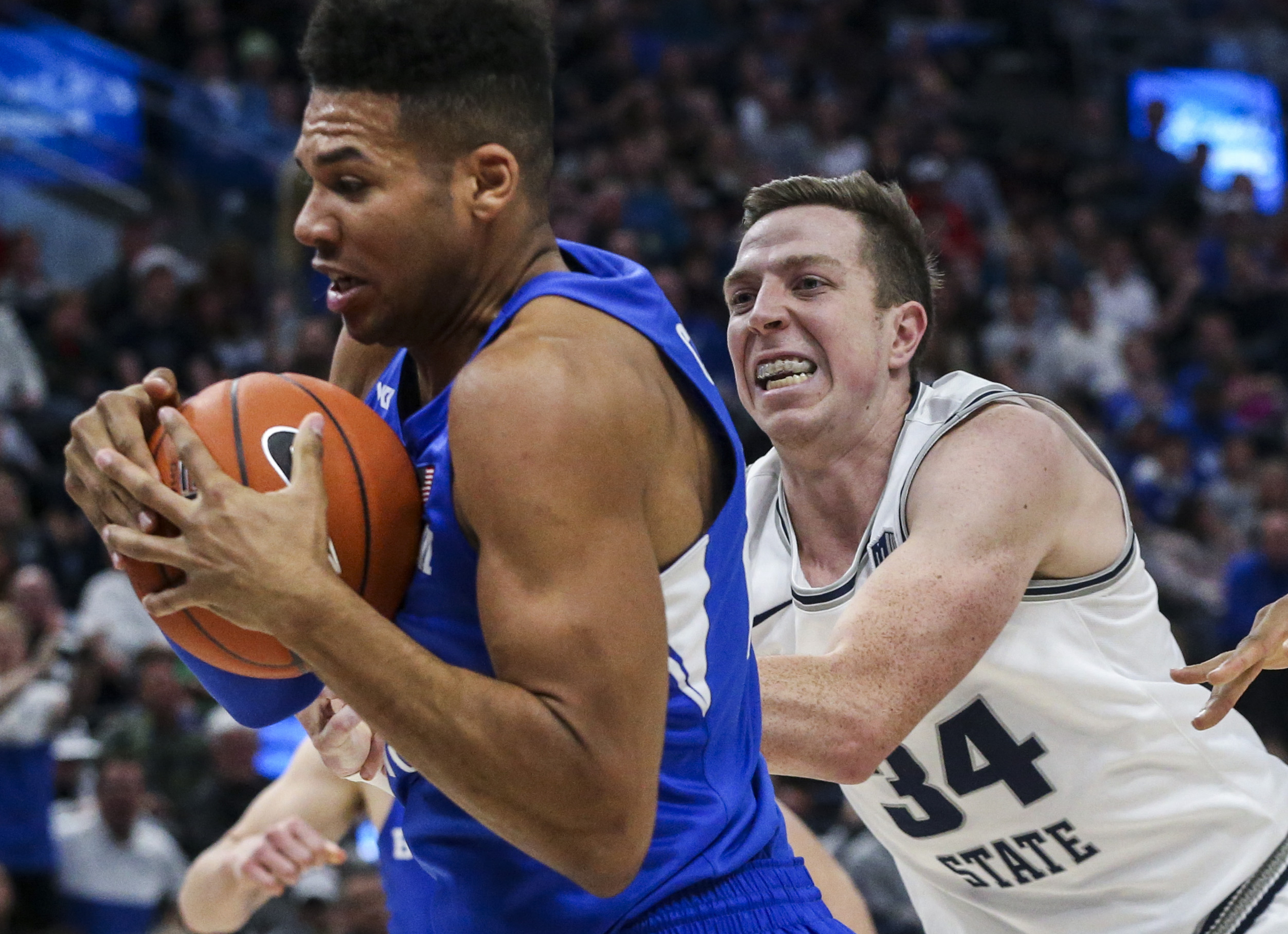 Brigham Young Cougars forward Yoeli Childs (23) protects a rebound from Utah State Aggies forward Justin Bean (34) during the second half of an NCAA basketball game in the Beehive Classic at Vivint Arena in Salt Lake City on Saturday, Dec. 14, 2019. BYU defeated Utah State 68-64 in regulation. (Photo: Colter Peterson, KSL)