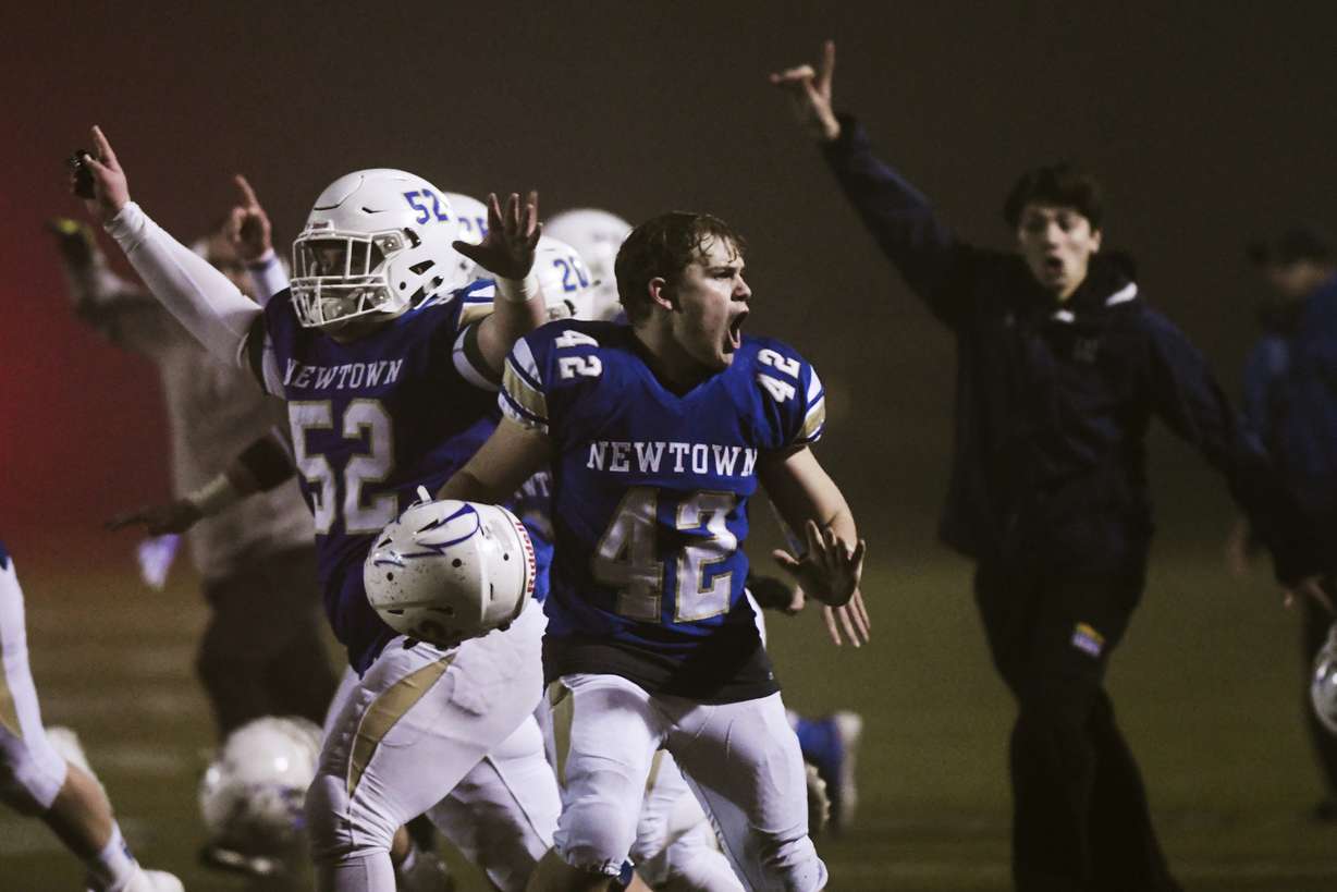 Newtown's Ben Pinto (42) reacts after the Newtown Nighthawks beat the Darien Blue Wave with a walk-off touchdown in the Class LL state football championship at Trumbull High School Saturday, Dec. 14, 2019, in Trumbull, Conn. Newtown won 13-7. Newtown marked the seventh anniversary of the massacre at Sandy Hook Elementary School with vigils, church services and a moment of joy when the community's high school football team, with a shooting victim's brother as linebacker, won the state championship Saturday in a last-minute thrill. (Photo: Kassi Jackson, Hartford Courant via AP)