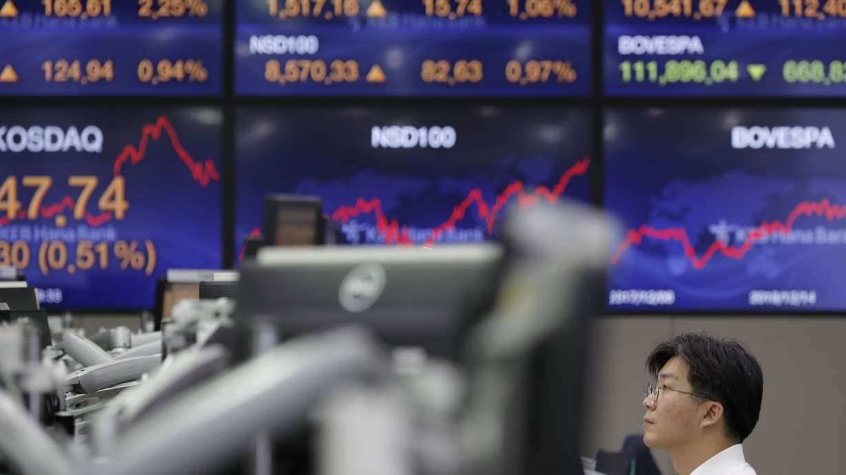 Global stock markets more subdued after US hits records