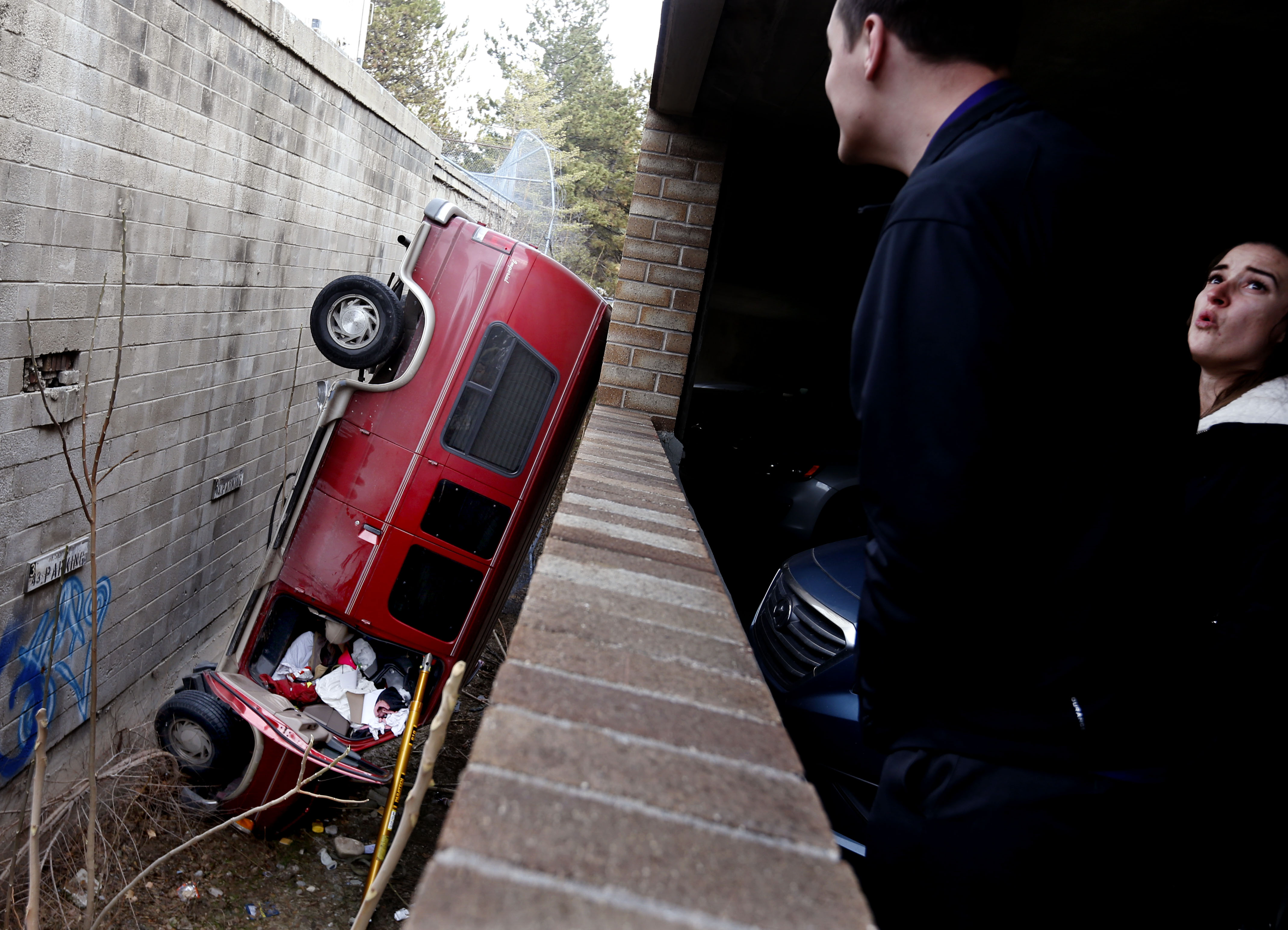 Van takes nosedive off Salt Lake parking structure