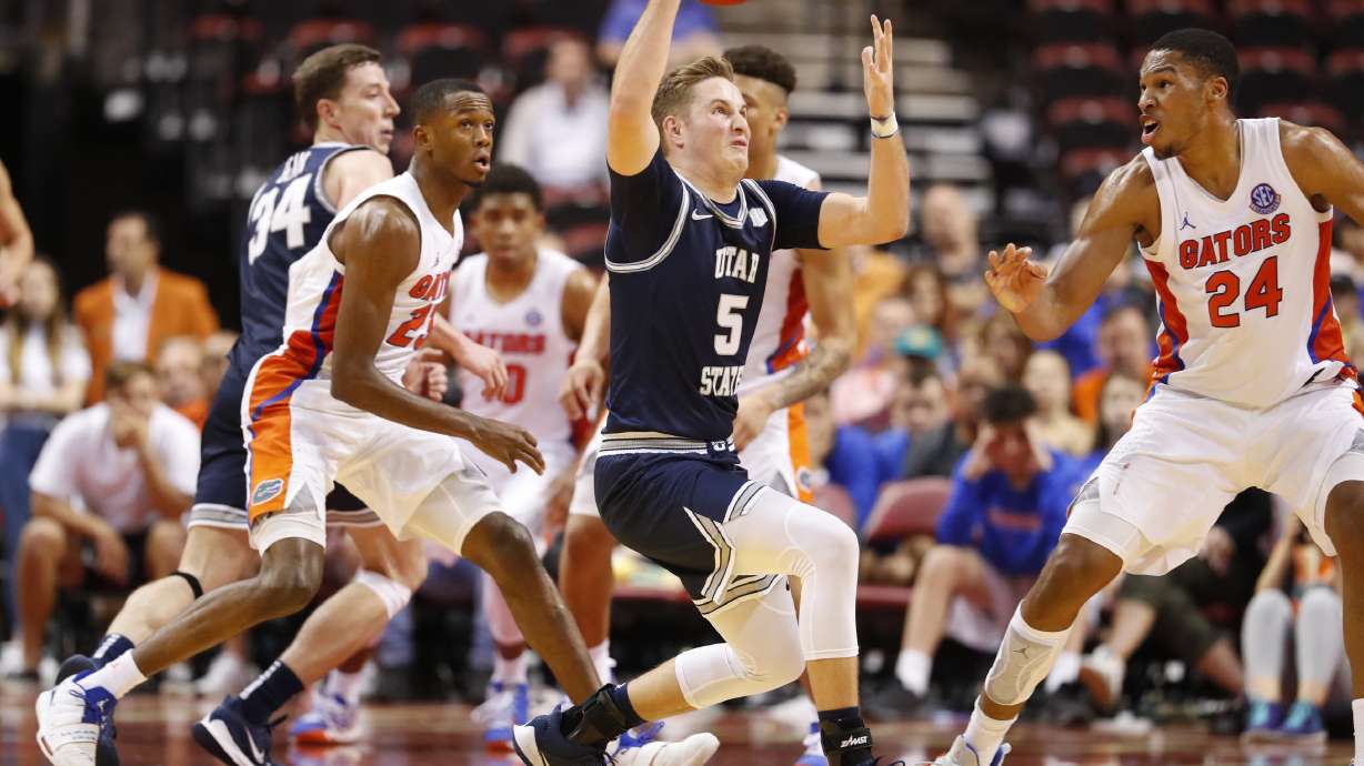 Sam Merrill’s 21 points help Utah State beat Florida 65-62