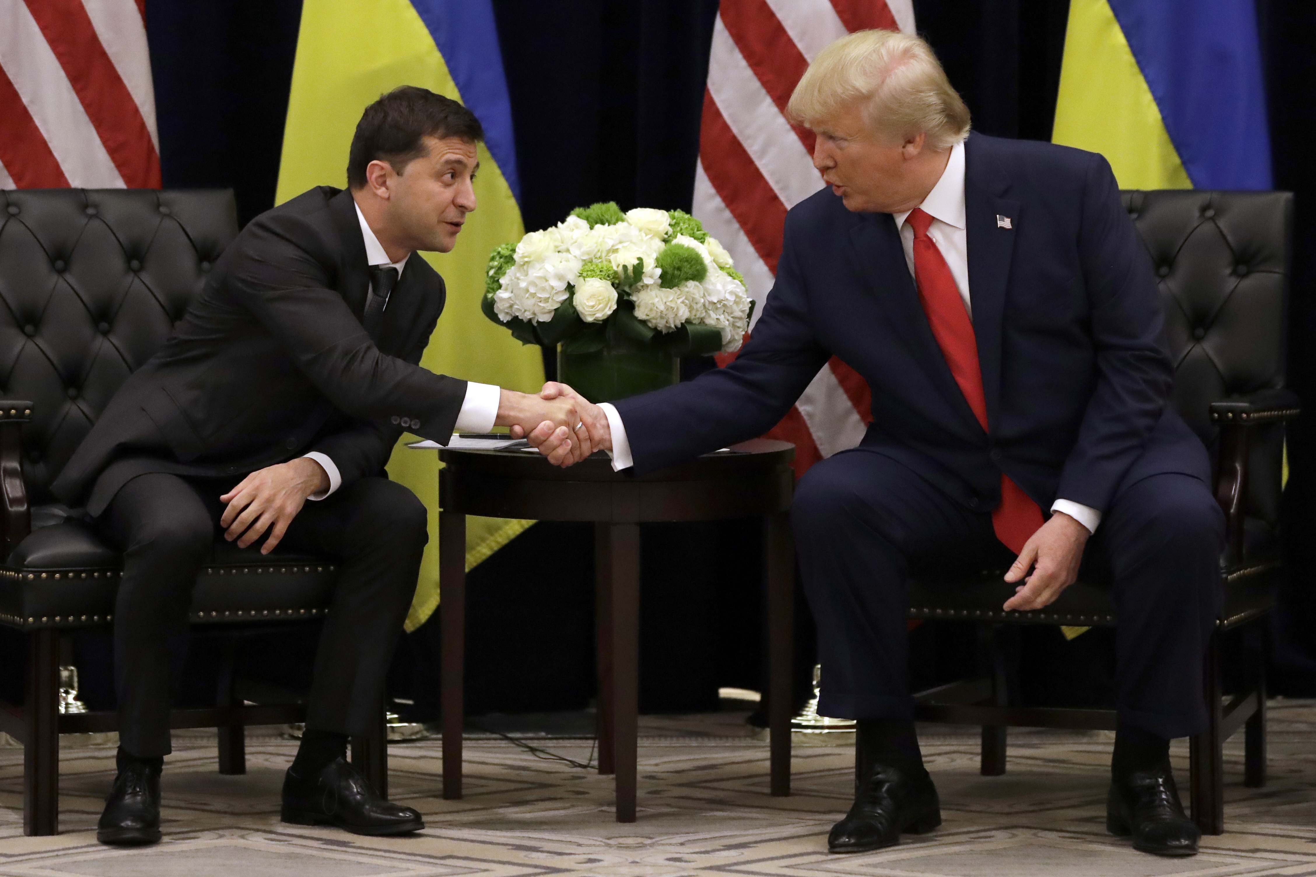 FILE - In this Sept. 25, 2019, file photo, President Donald Trump meets with Ukrainian President Volodymyr Zelenskiy at the InterContinental Barclay New York hotel during the United Nations General Assembly in New York. (AP Photo/Evan Vucci, File)