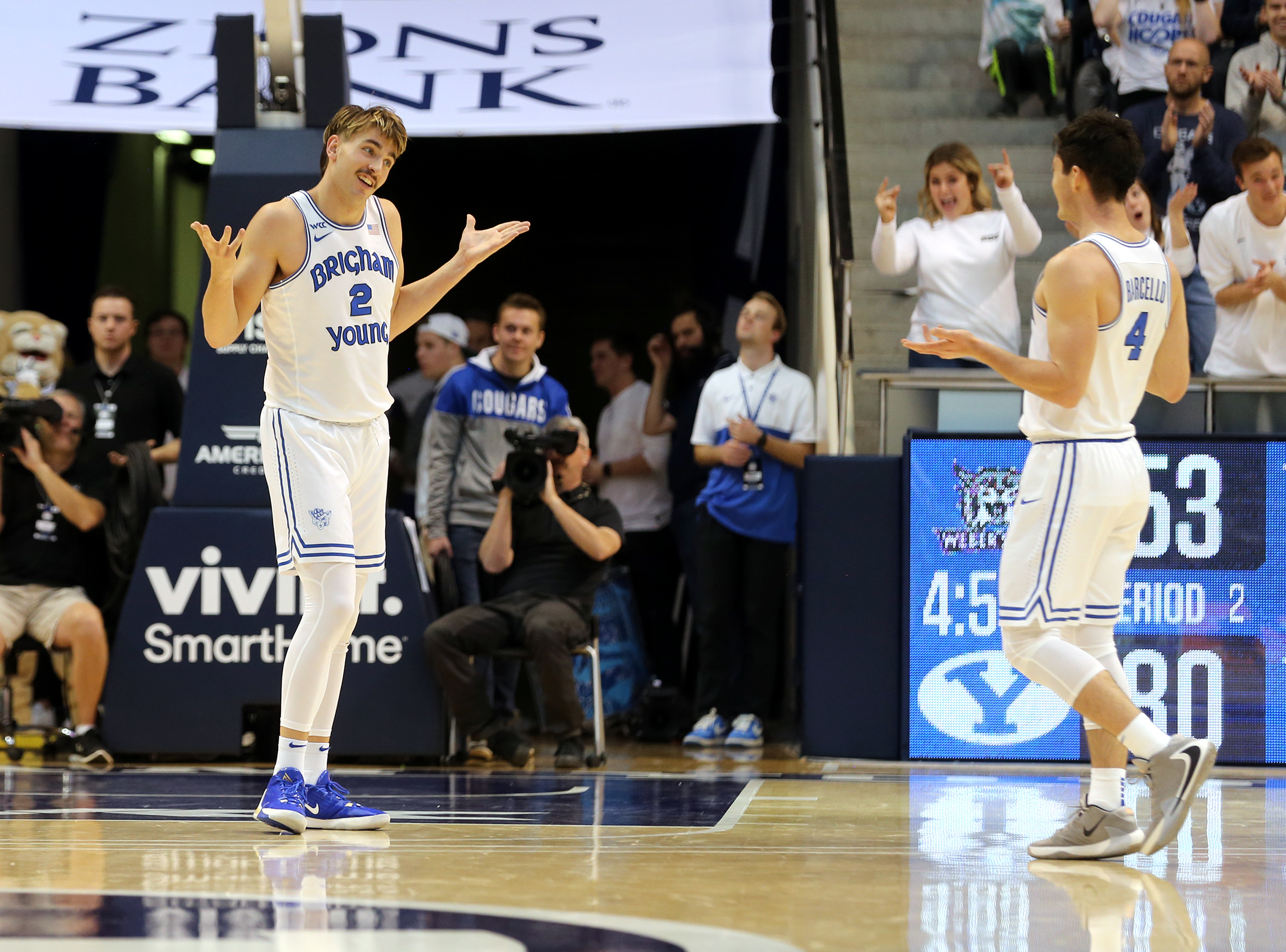 BYU Cougars guards Zac Seljaas (2) and Alex Barcello (4) celebrate as Weber State calls a timeout as BYU and Weber State play an NCAA basketball game at the Marriott Center in Provo on Saturday, Dec. 21, 2019. BYU won 91-61. (Photo: Scott G Winterton, KSL)