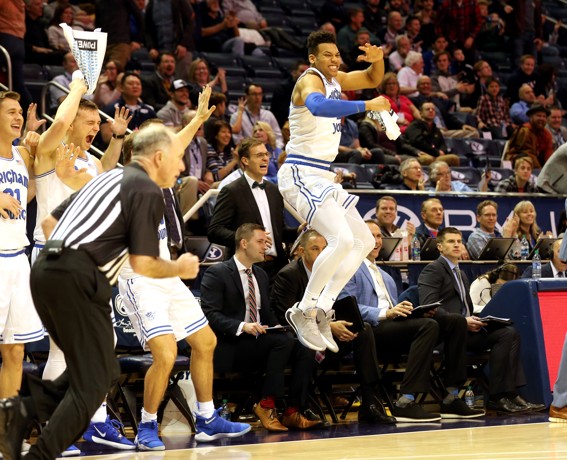 BYU Cougars forward Yoeli Childs (23) and the other players on the bench celebrate after guard TJ Haws (30) dunked as BYU and Weber State play an NCAA basketball game at the Marriott Center in Provo on Saturday, Dec. 21, 2019. BYU won 91-61. (Photo: Scott G Winterton, KSL)
