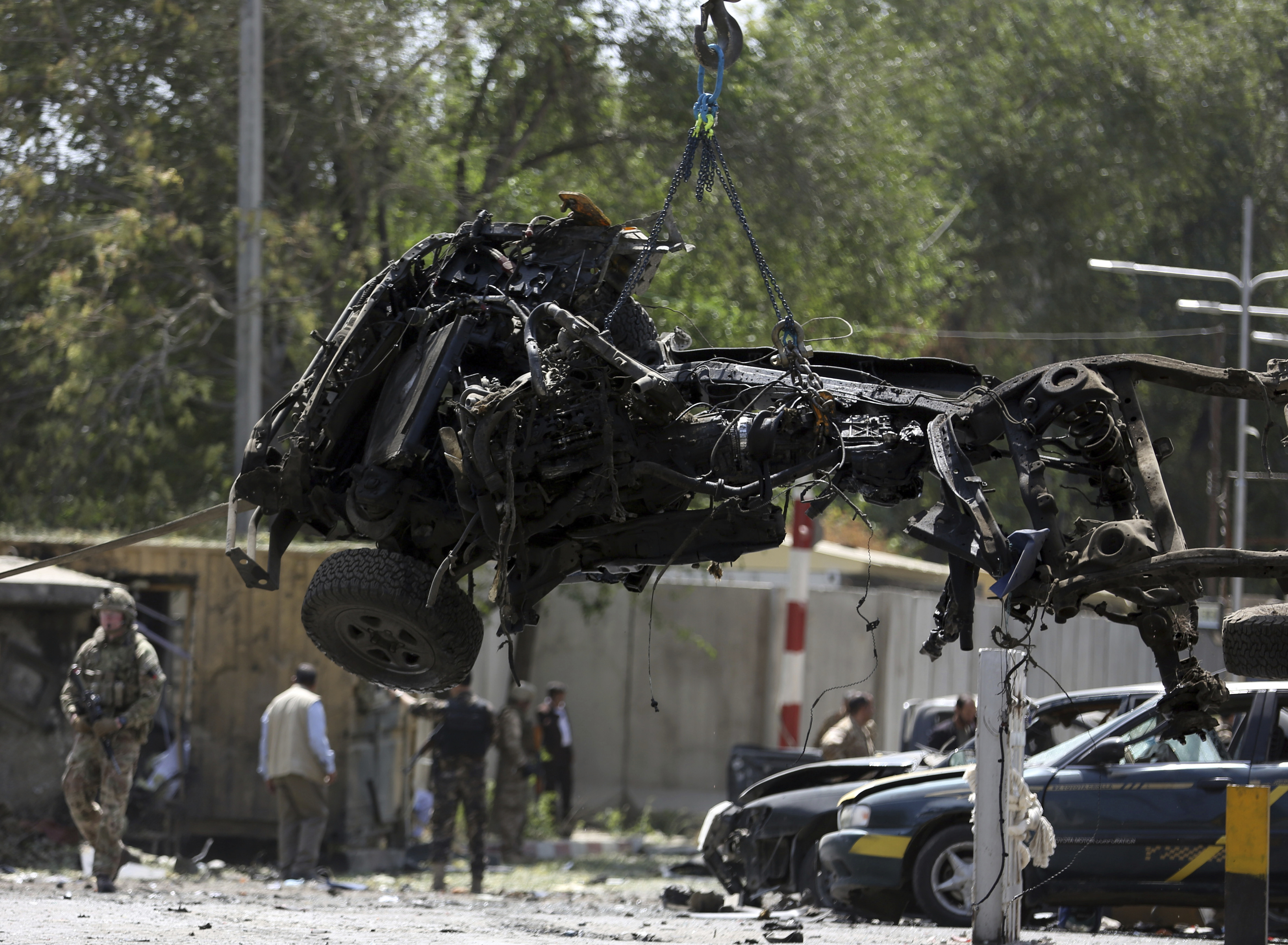File- in this Thursday, Sept. 5, 2019. Photo, Resolute Support (RS) forces remove a destroyed vehicle after a car bomb explosion in Kabul, Afghanistan. Photo: AP Photo