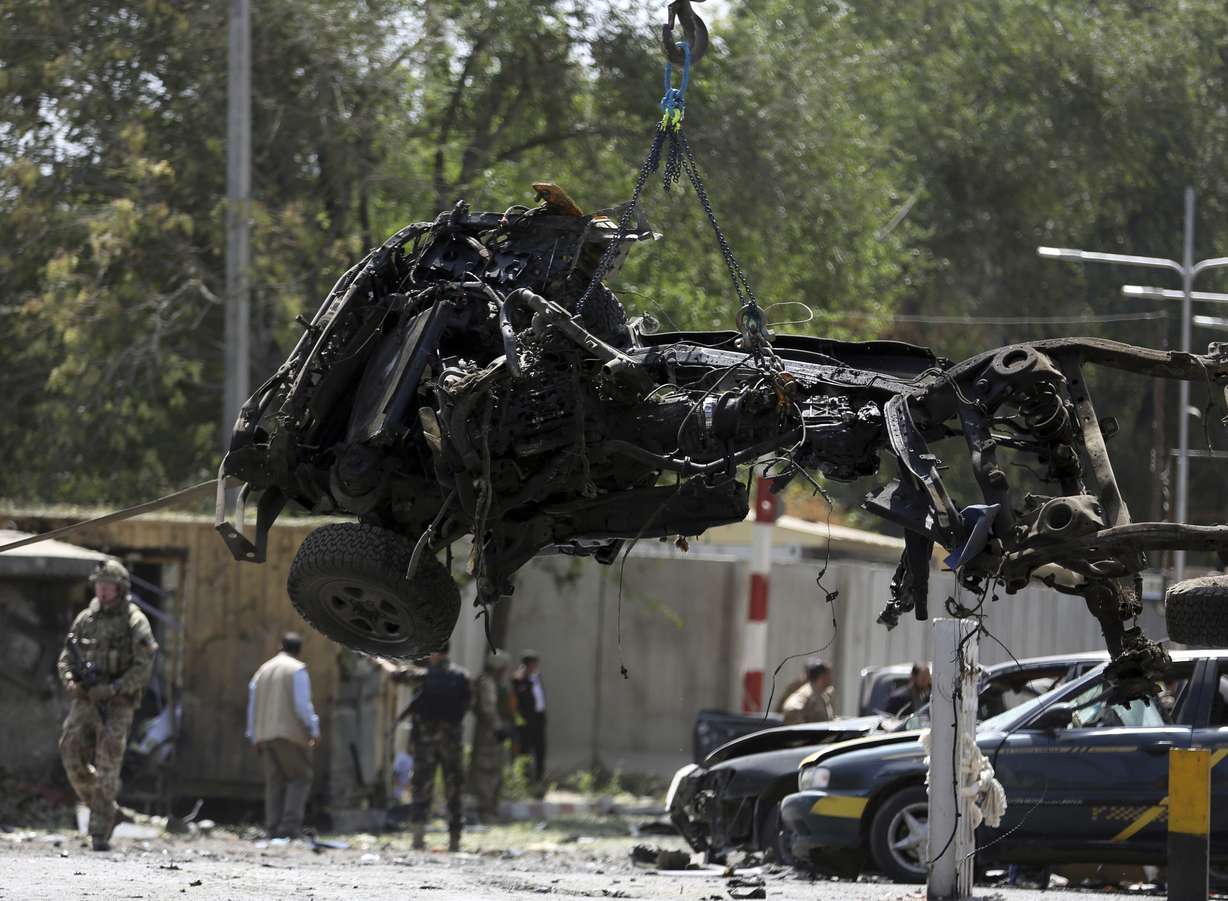 File- in this Thursday, Sept. 5, 2019. Photo, Resolute Support (RS) forces remove a destroyed vehicle after a car bomb explosion in Kabul, Afghanistan. Photo: AP Photo