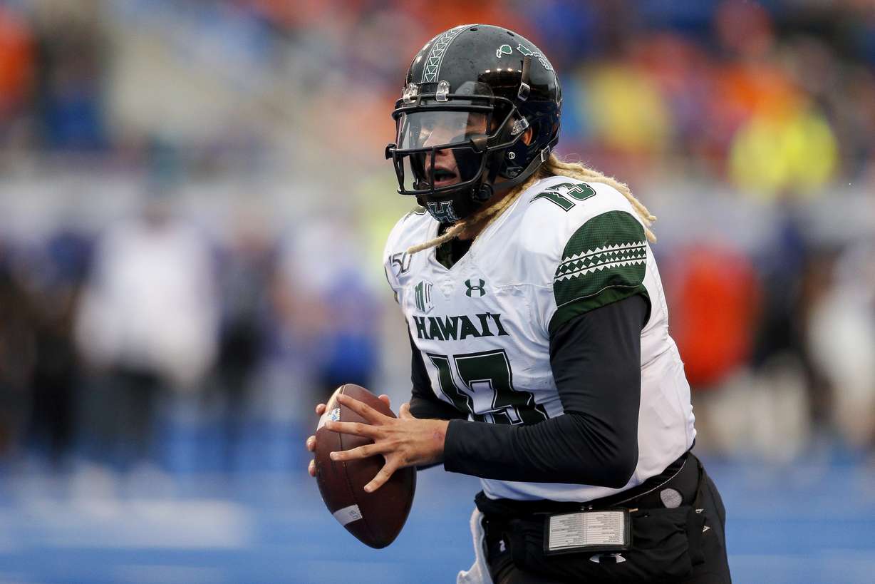 Hawaii quarterback Cole McDonald (13) looks down field against Boise State during the second half of an NCAA college football game for the Mountain West Championship Saturday, Dec. 7, 2019, in Boise, Idaho. Boise State won 31-10. (Photo: Steve Conner, AP)