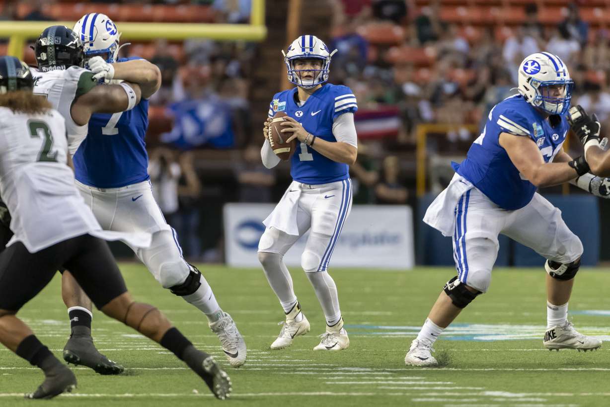 BYU quarterback Zach Wilson (1) drops back to pass during the second half of the team's Hawaii Bowl NCAA college football game against Hawaii, Tuesday, Dec. 24, 2019, in Honolulu. (Photo: Eugene Tanner, AP)