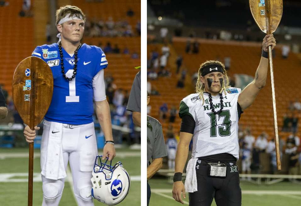 BYU quarterback Zach Wilson and Hawaii's Cole McDonald each hold the award after being named their team's respective Most Valuable Players in the Hawaii Bowl college football game, Tuesday, Dec. 24, 2019, in Honolulu. Hawaii won 38-34. (Photos: Eugene Tanner, AP)