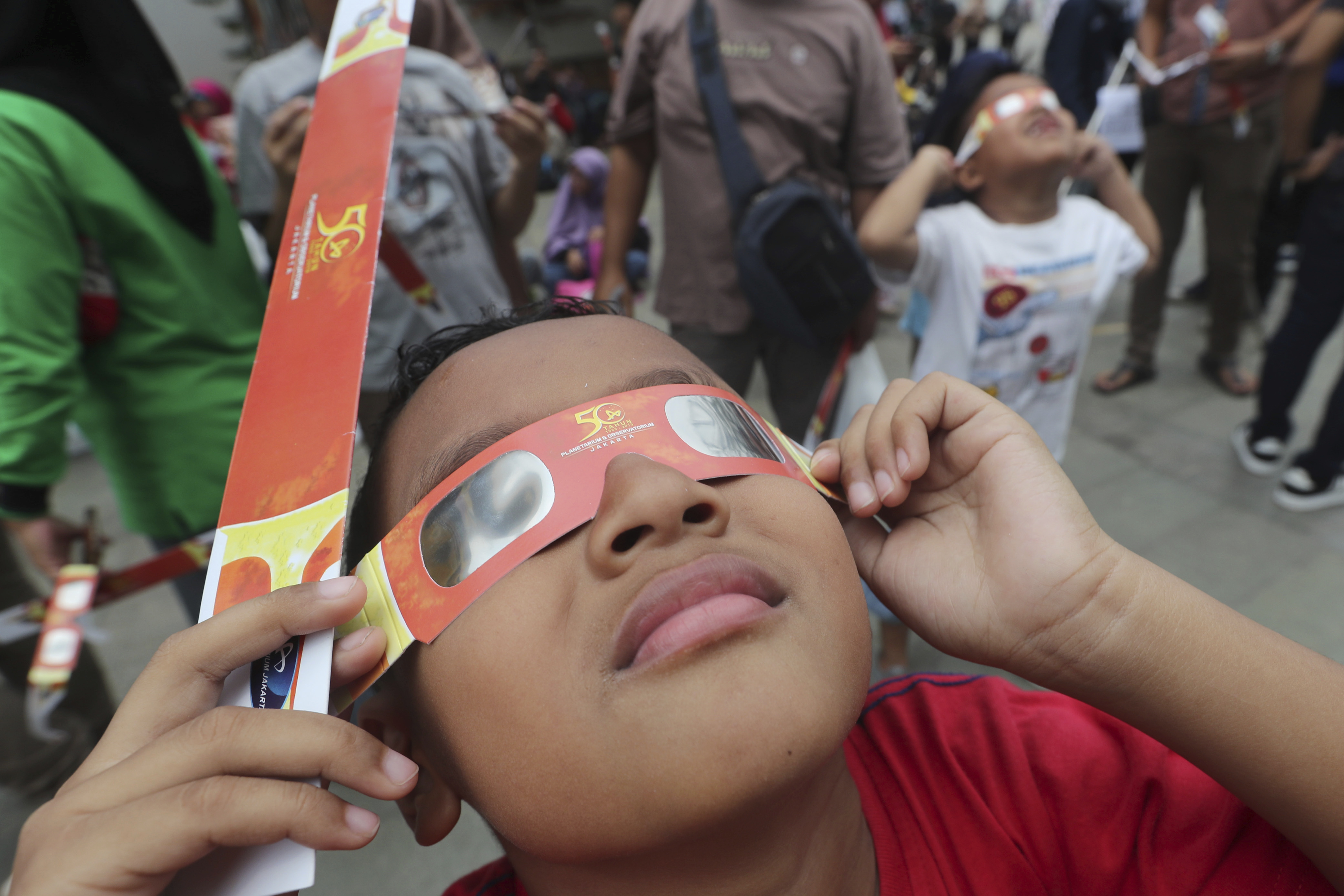 Thousands in Asia marvel at 'ring of fire' solar eclipse