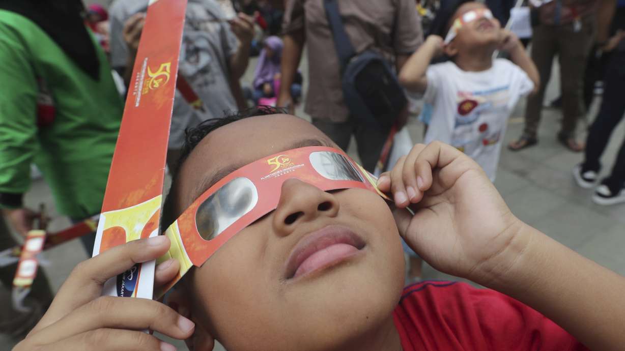 Thousands in Asia marvel at 'ring of fire' solar eclipse