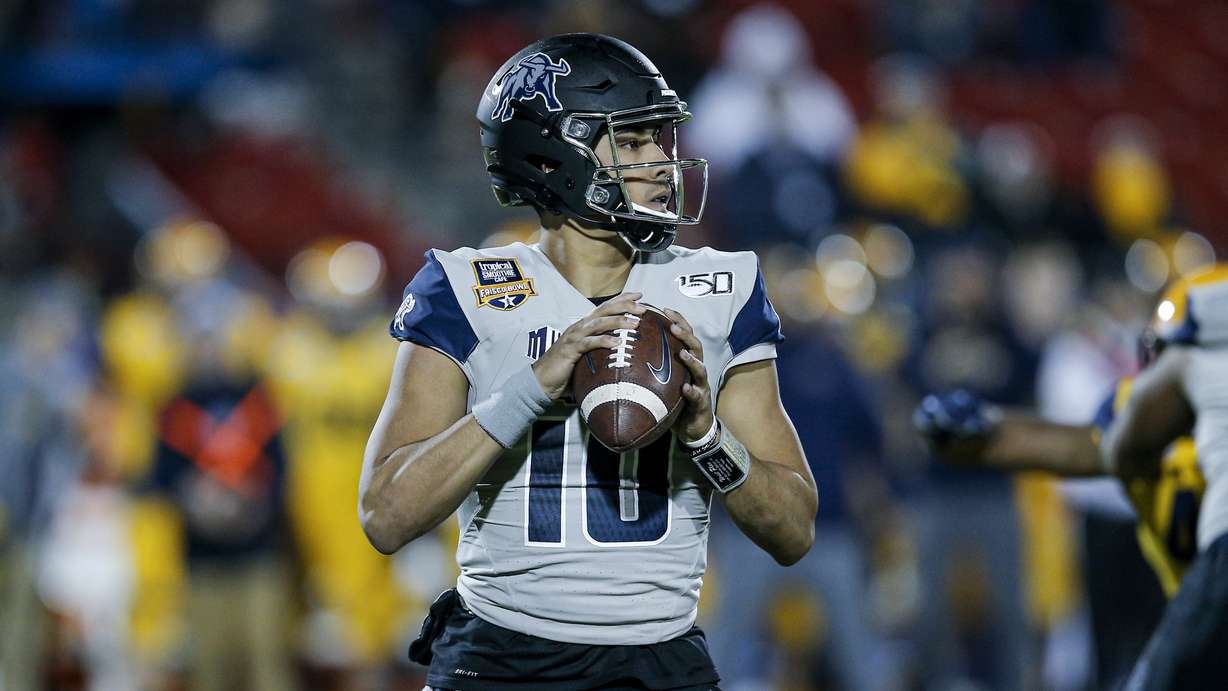 Utah State quarterback Jordan Love (10) looks to pass during the first half of the Frisco Bowl NCAA college football game against Kent State Friday, Dec. 20, 2019, in Frisco, Texas. Kent State won 51-41. (AP Photo/Brandon Wade)