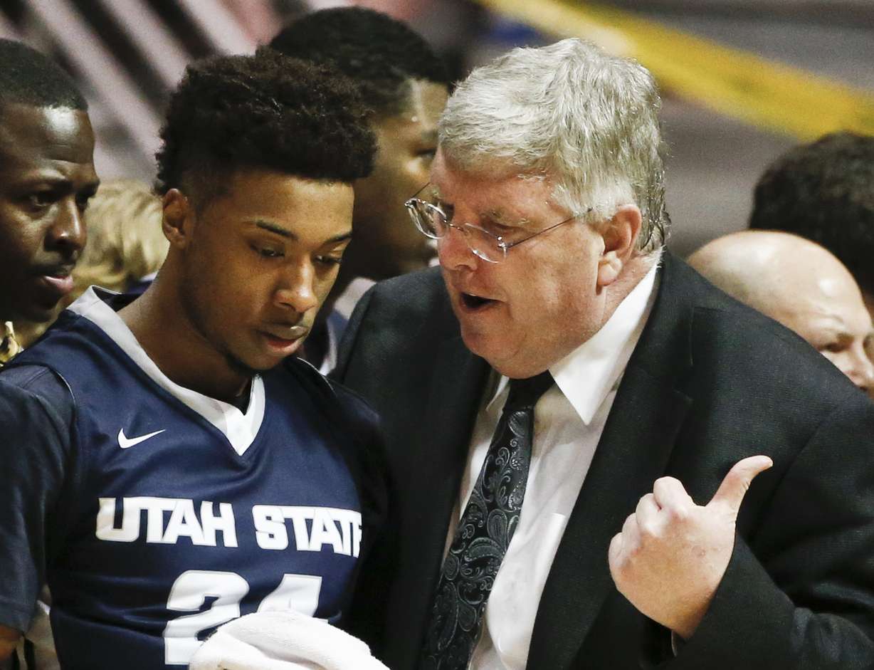 Stew Morrill talks to guard JoJo McGlaston in the first half of an NCAA college basketball game during his final season. (AP Photo/Lenny Ignelzi)