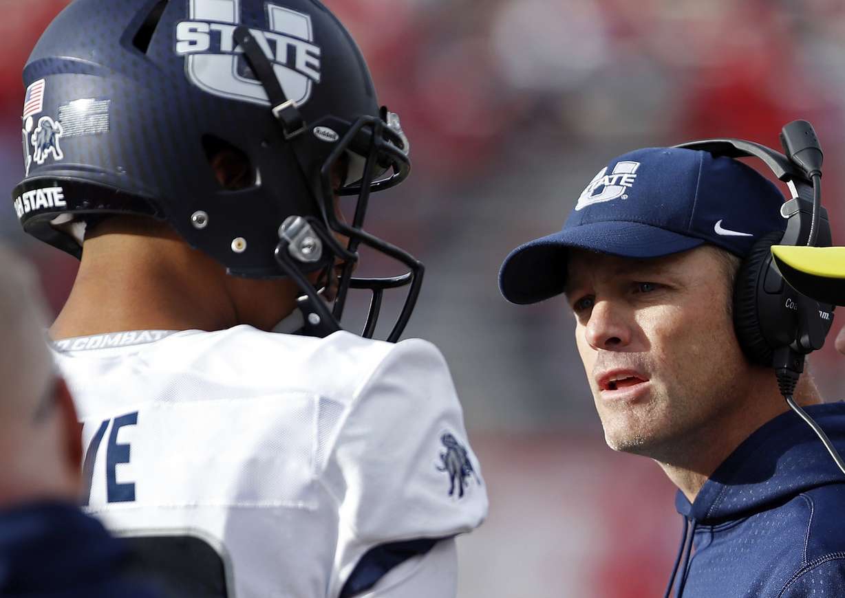 Utah State coach Matt Wells and Jordan Love led the Aggies to a historic season in 2018. (AP Photo/Andres Leighton)
