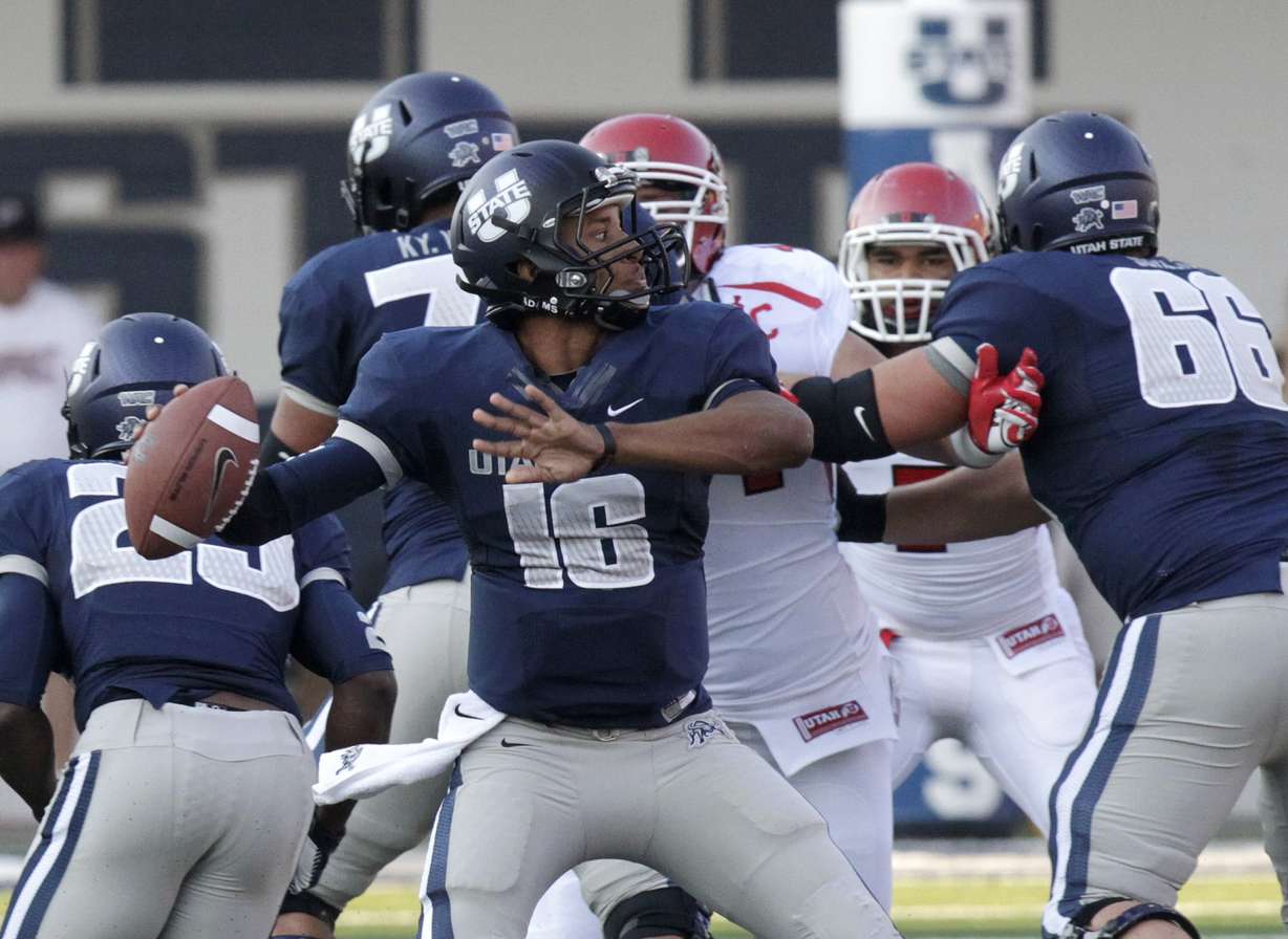 Chuckie Keeton passes the ball during USU's win over Utah in 2012. (Rick Bowmer, AP Photo)