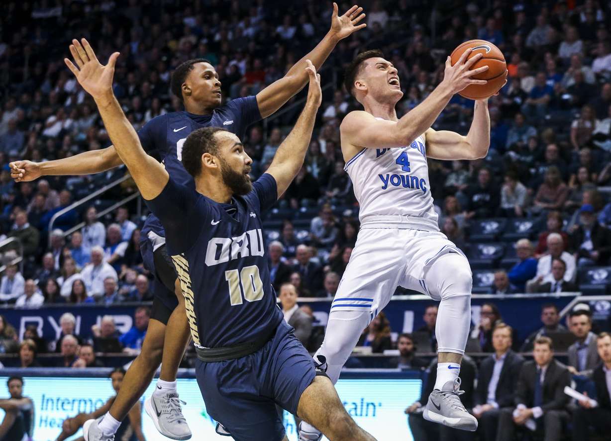 BYU guard Alex Barcello (4) goes for a layup against Oral Roberts Golden Eagles guard Sam Kearns (10) and guard Max Abmas (3) during the first half of an NCAA men's basketball game at the Marriott Center in Provo on Saturday, Dec. 28, 2019. (Photo: Colter Peterson, KSL)