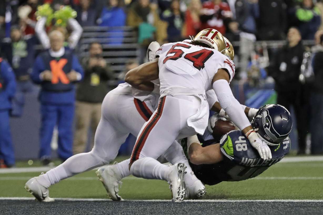 Seattle Seahawks tight end Jacob Hollister (48) is stopped just short of the goal line by San Francisco 49ers middle linebacker Fred Warner (54) and linebacker Dre Greenlaw, left, during the second half of an NFL football game, Sunday, Dec. 29, 2019, in Seattle. The 49ers won 26-21. (Photo: Ted S. Warren, AP)