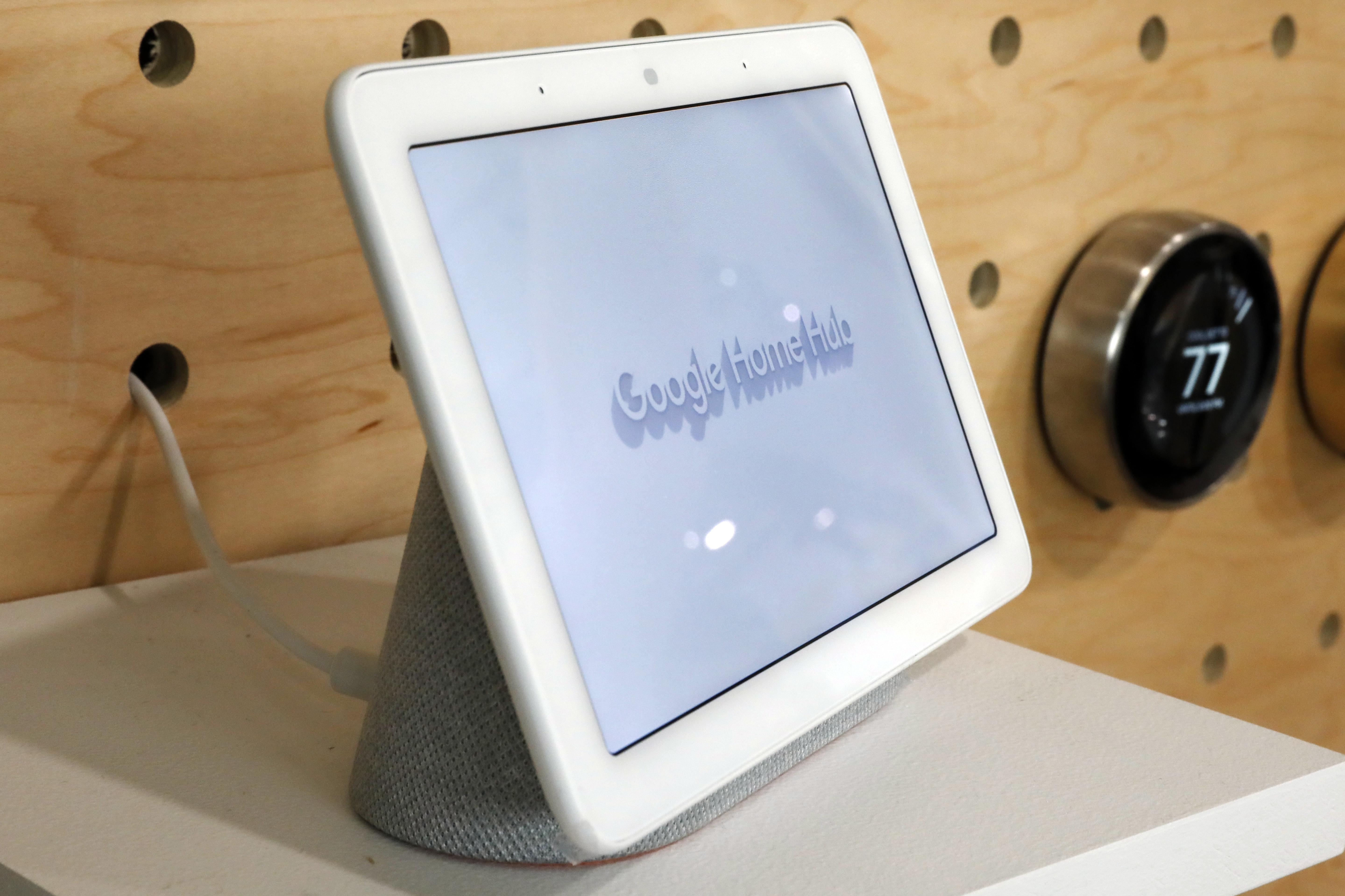 This Oct. 9, 2018 file photo shows a Google Home Hub displayed in New York. Many of these internet-connected speaker devices listen constantly for commands and connect to corporate servers to carry them out. Typically, they will ignore private chatter and transmit sound recordings only when you trigger the device, such as by pressing a button or speaking a command phrase like "OK Google.” Some gadgets also have a mute button to disable the microphones completely. But there's no easy way for consumers to verify those safeguards. (AP Photo/Richard Drew, File)