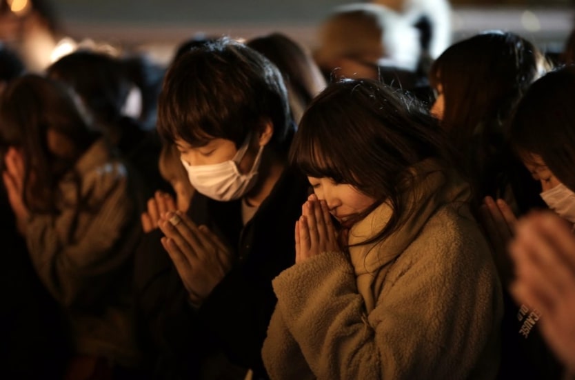 People offer their new year's prayers at the Meiji Jingu Shinto shrine as they celebrate the arrival of the year 2020, Wednesday, Jan 1, 2020, in Tokyo. (AP Photo/Kiichiro Sato)