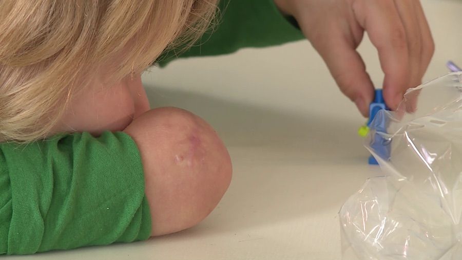 Austin Brown plays with Legos at his home in Layton on Wednesday, Dec. 11, 2019. Austin was playing in the backyard of his home on March 3 when two huskies from the neighbor’s yard got a hold of his arm from underneath the fence and chewed it off. (Photo: Mark Wetzel, KSL, File)