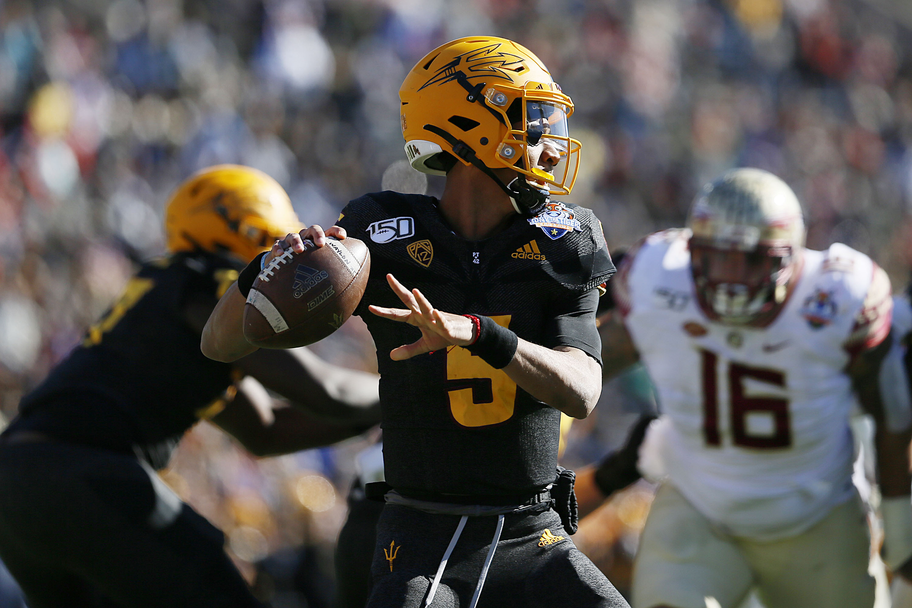 Arizona State quarterback Jayden Daniels looks to pass during the Sun Bowl NCAA college football game against Florida State, Dec. 31, 2019 in El Paso, Texas.