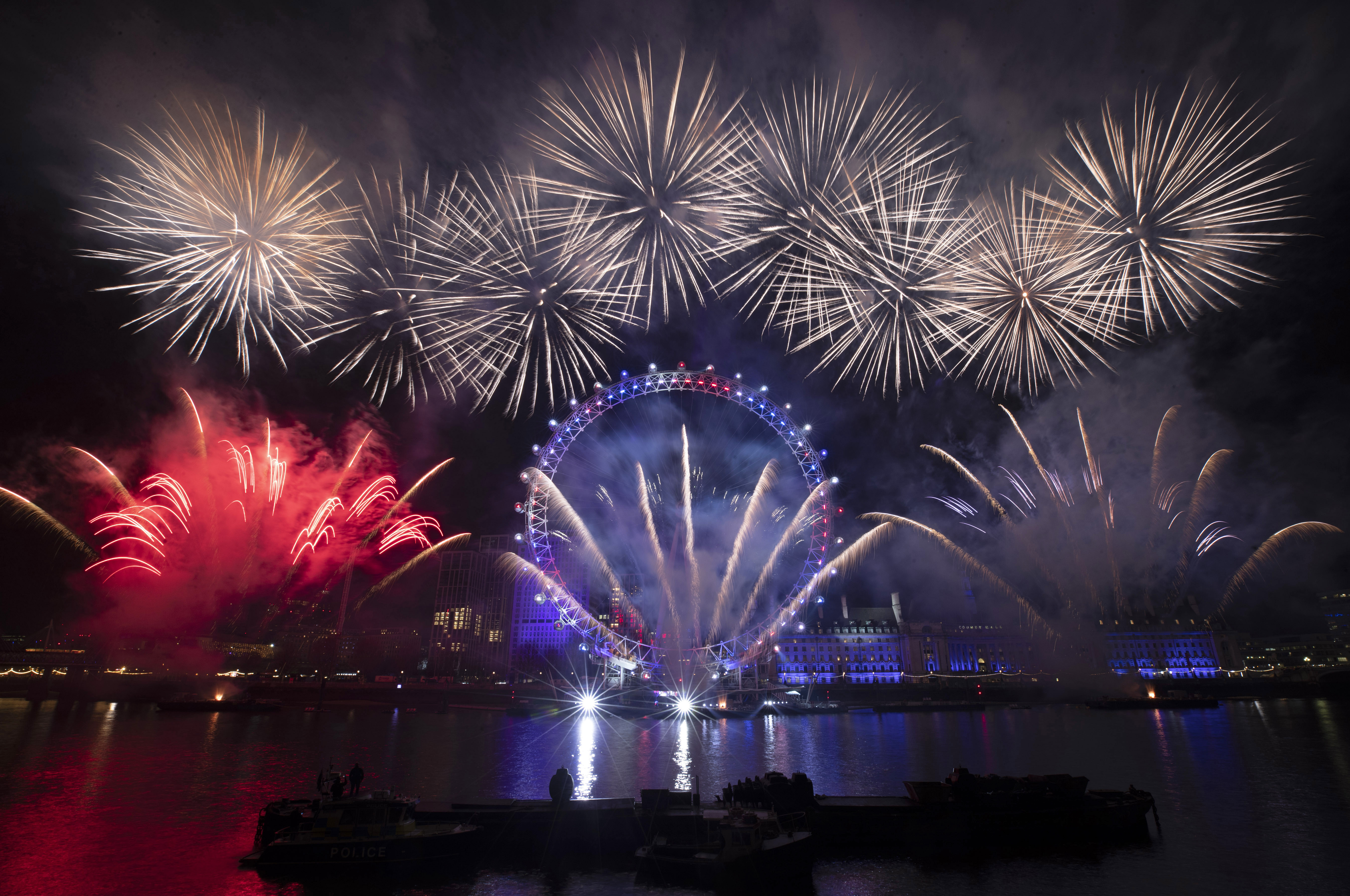 Fireworks explode over the London Eye Ferris wheel by the River Thames in London, to mark the start of the new year, Wednesday, Jan. 1, 2020. (Matt Dunham, AP Photo)