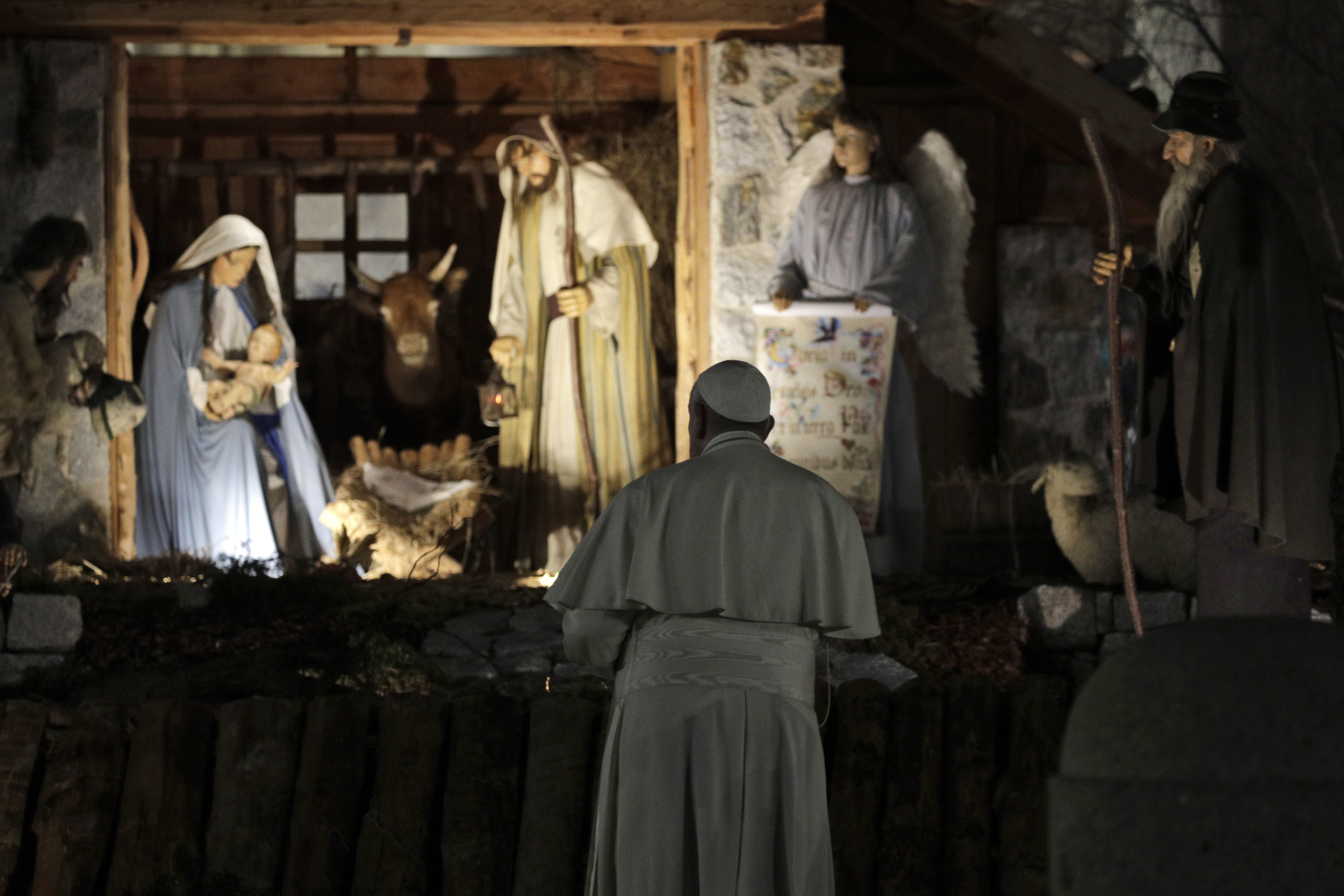 Pope Francis stops by the Nativity exposed in St. Peter's square after presiding over vespers of the Feast of St. Mary and Te Deum of Thanksgiving at year's end, in St. Peter's Basilica at the Vatican, Tuesday, Dec. 31, 2019. (Gregorio Borgia, AP Photo)