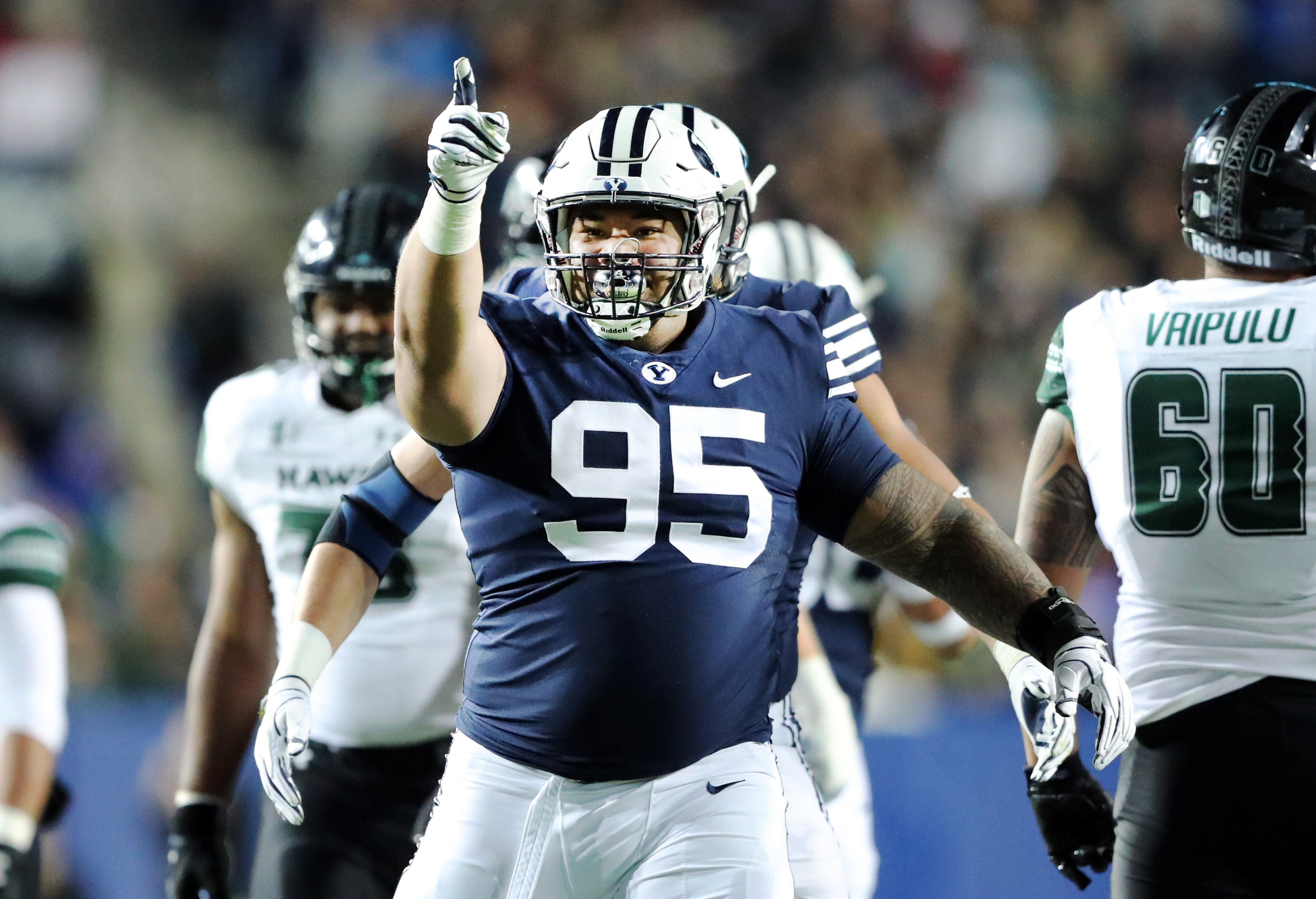 BYU defensive lineman Khyiris Tonga celebrates a sack on Hawaii Warriors quarterback Cole McDonald Saturday, Oct. 13, 2018.
