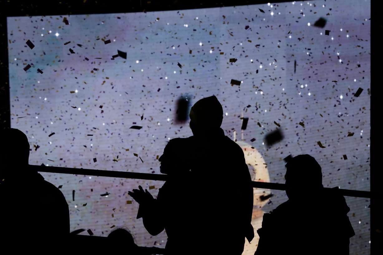 People throw confetti as revelers wait for midnight during the New Year's Eve celebration in New York's Times Square, as seen from above from the New York Marriott Marquis hotel, Tuesday, Dec. 31, 2019. (Frank Franklin II, AP Photo)