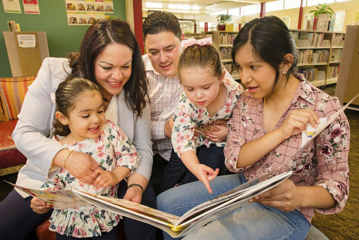 This undated photo provided by the Luz Escamilla Campaign shows Utah lawmaker and Salt Lake City former mayoral candidate Luz Escamilla with her husband Juan Carlos and three of her children, Aileen, Sol and Cielo, in Salt Lake City. She was among the first candidates to use a new Utah law that allows campaign money to be used for childcare. (Brandon Cruz, Luz Escamilla Campaign via AP)