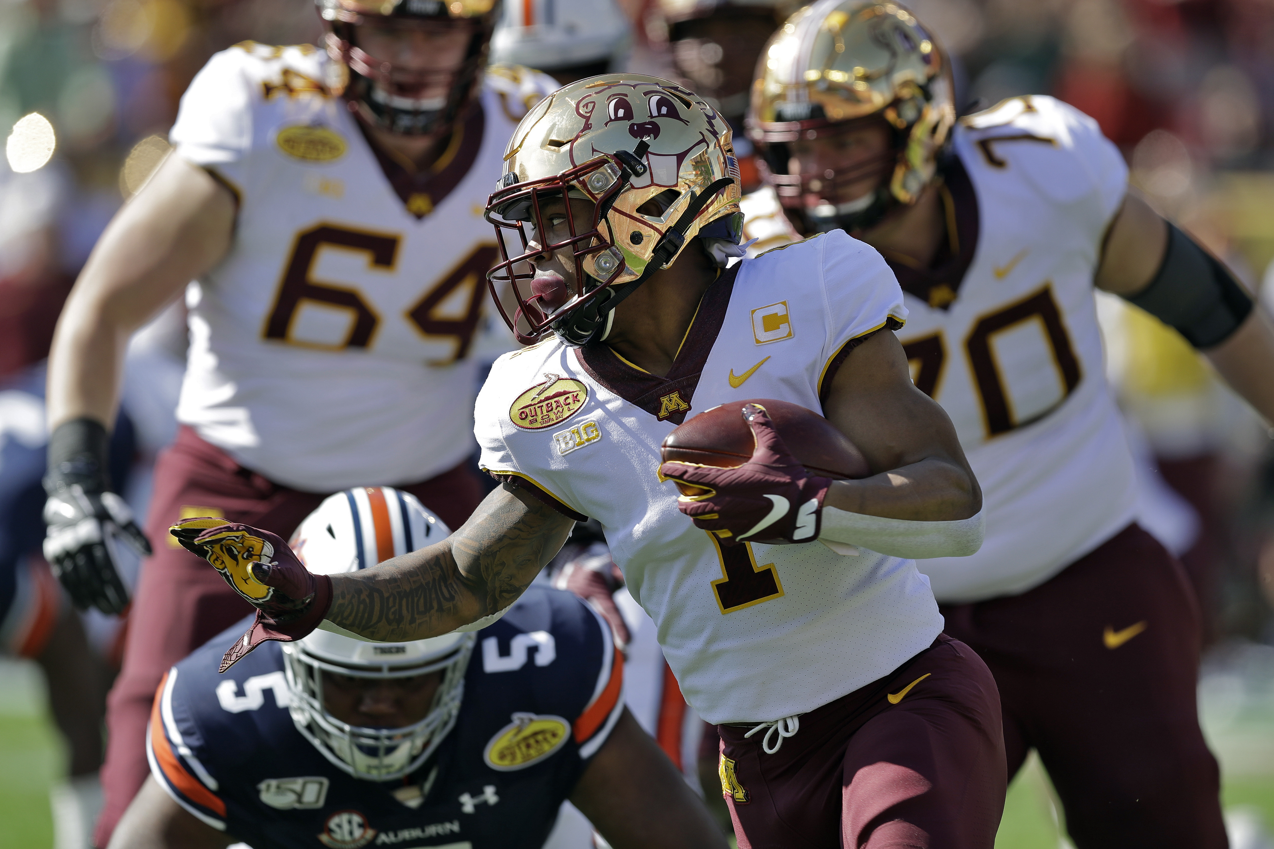 Johnson lifts No. 16 Minnesota over No. 9 Auburn in Outback