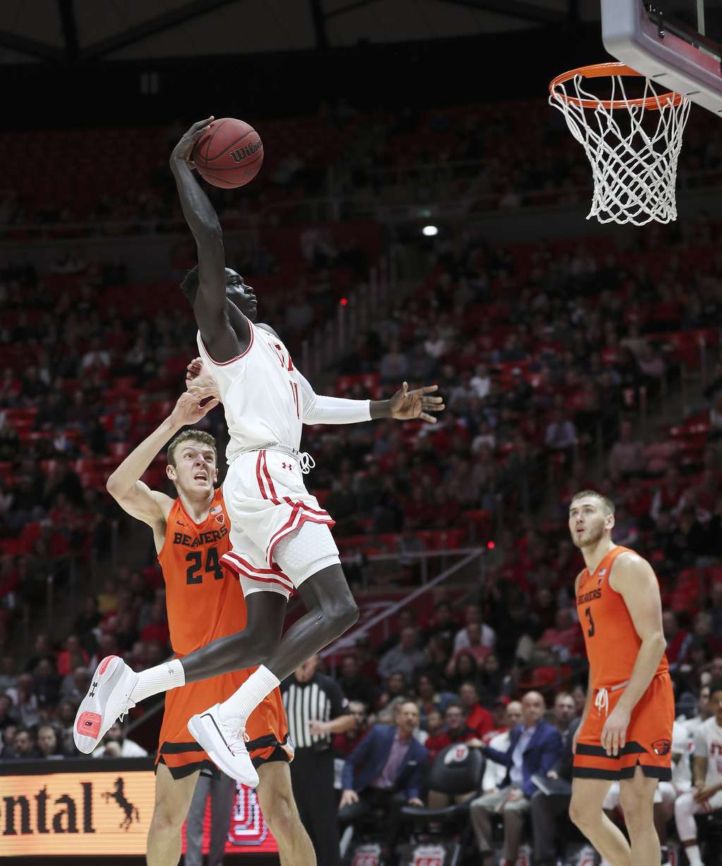 Utah Utes guard Both Gach (11) flies to the basket, passing Oregon State Beavers forward Kylor Kelley (24), in Salt Lake City on Thursday, Jan. 2, 2020. Utah won 81-69. (Photo: Jeffrey D. Allred, KSL)